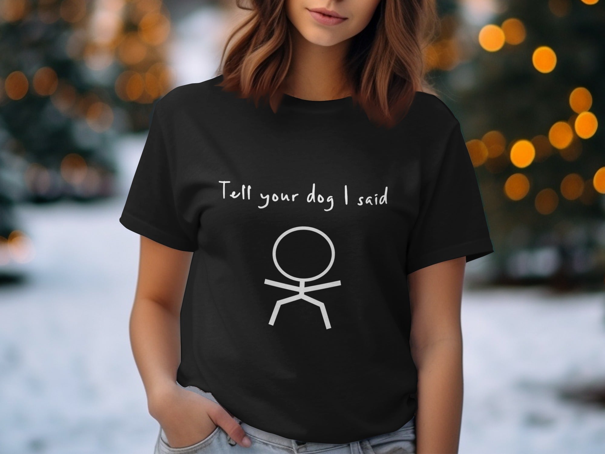 Black t-shirt with "Tell your dog I said" and stick figure graphic.