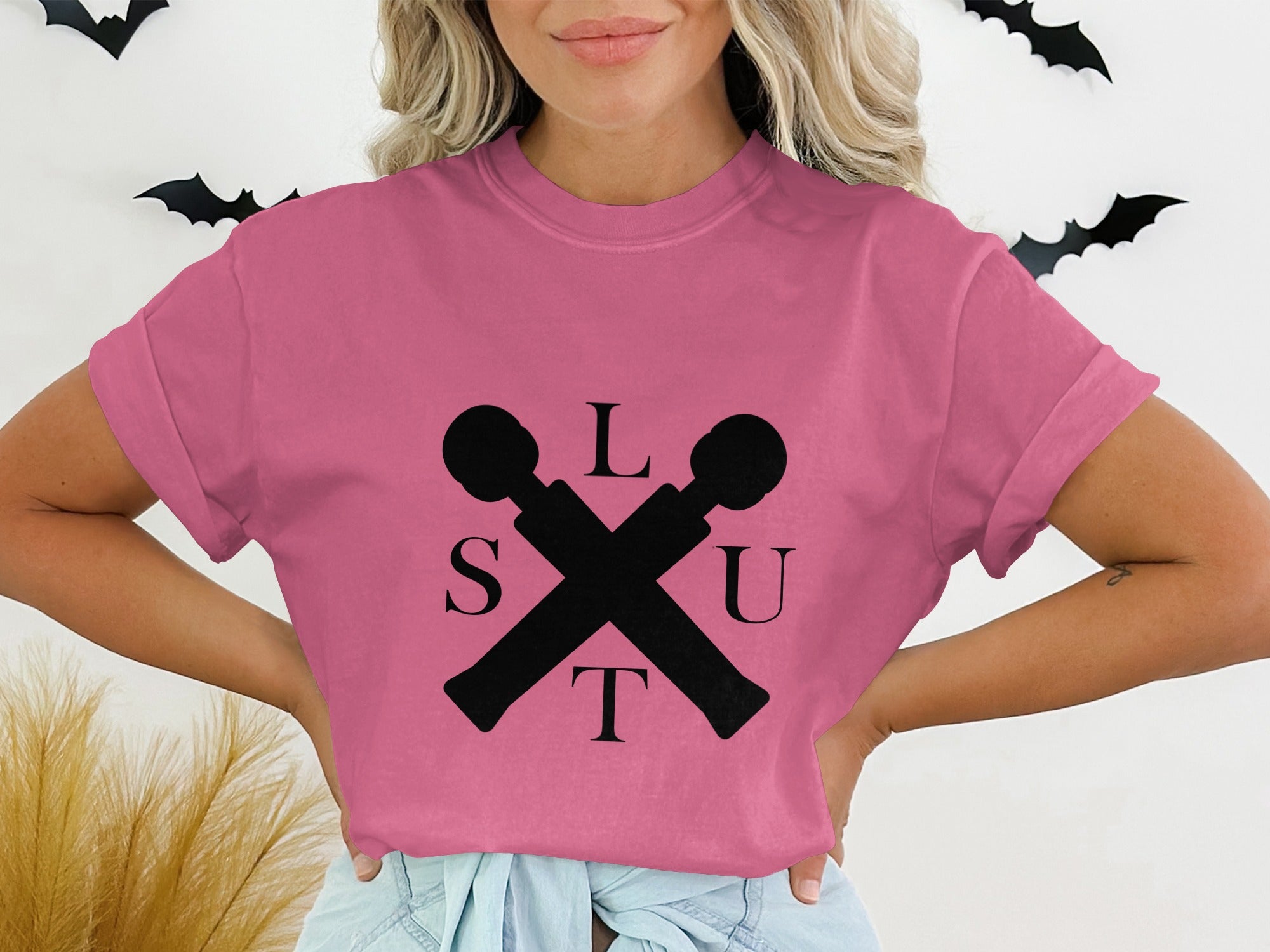 Stylish Pink Graphic Tee with Decorative Letter Design
