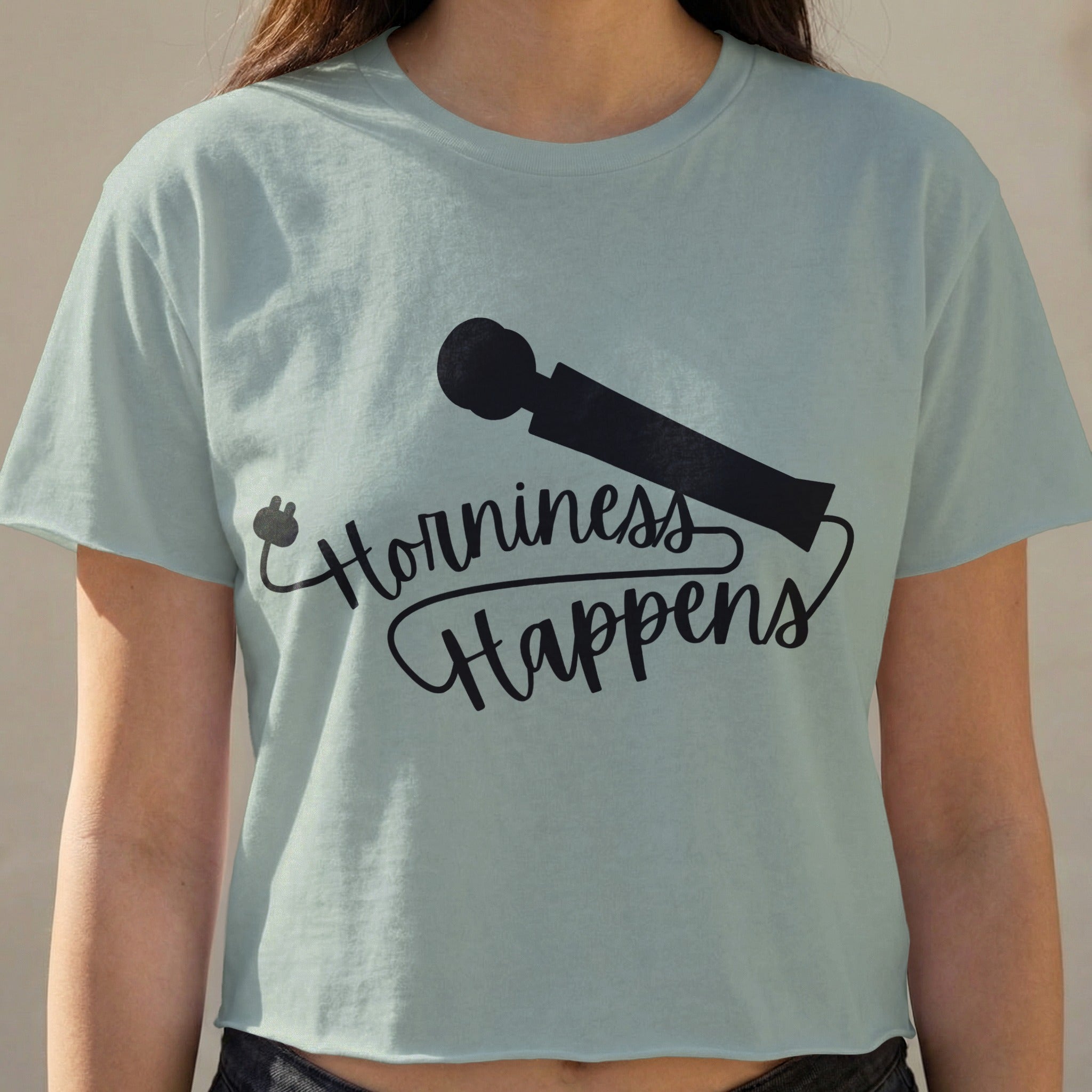 Light blue t-shirt with "Horniness Happens" and a plug and vibrator graphic.