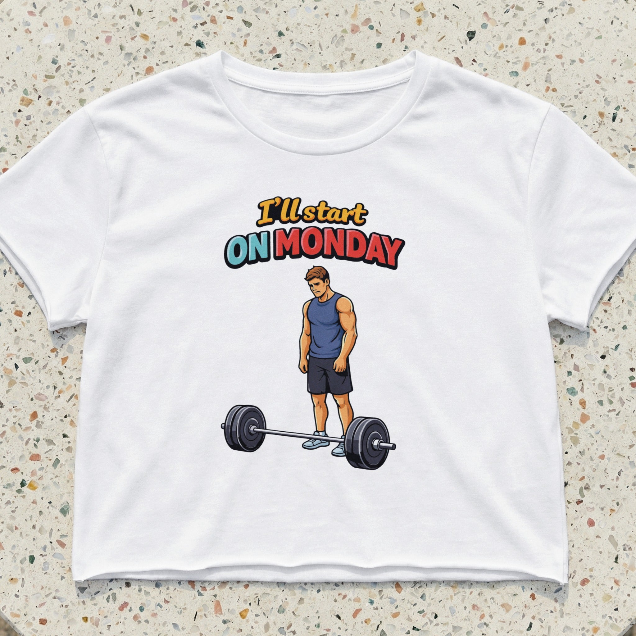 White cropped t-shirt with text "I'll start ON MONDAY" and a cartoon man lifting weights.