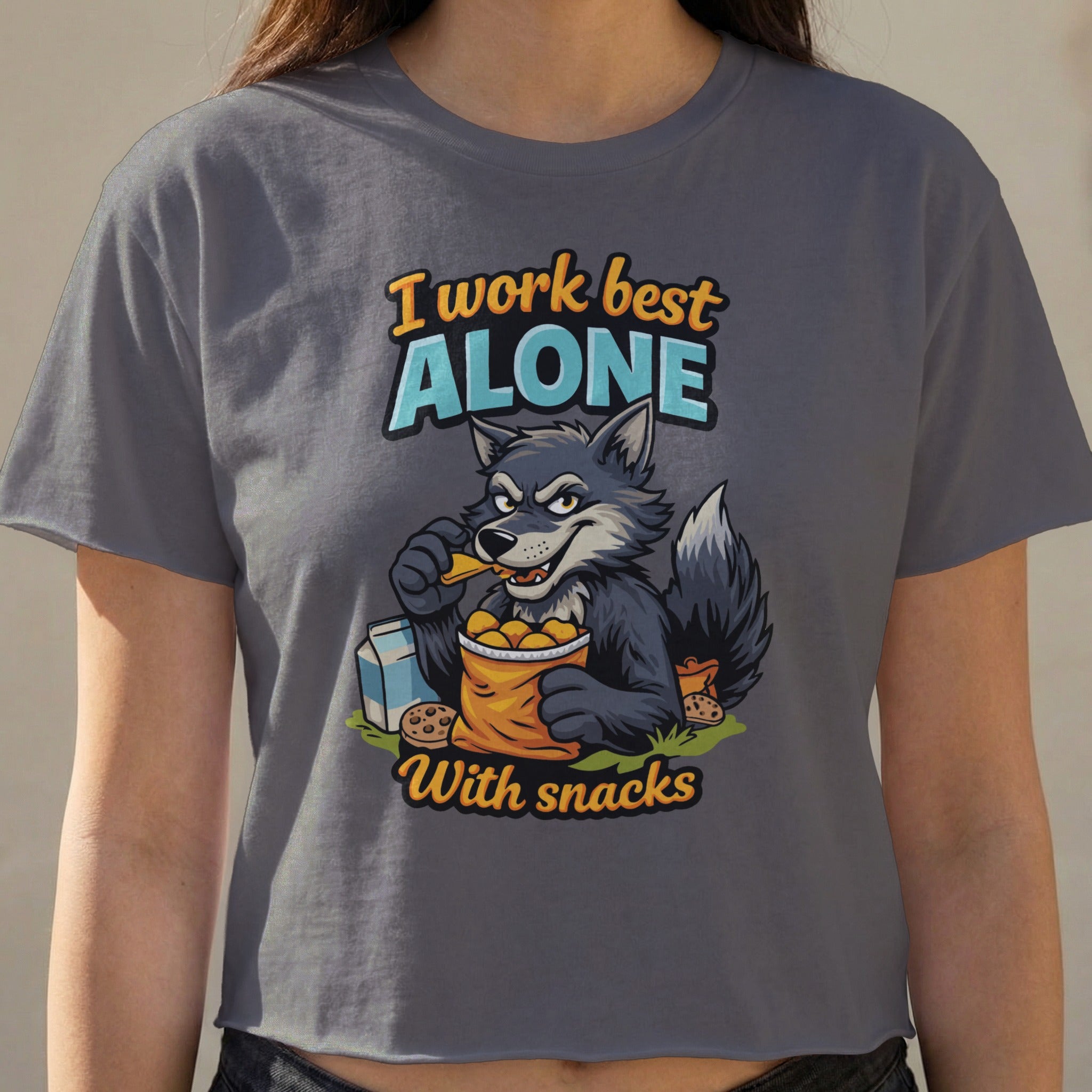 Wolf character in grey crop top shirt with text "I work best alone with snacks".