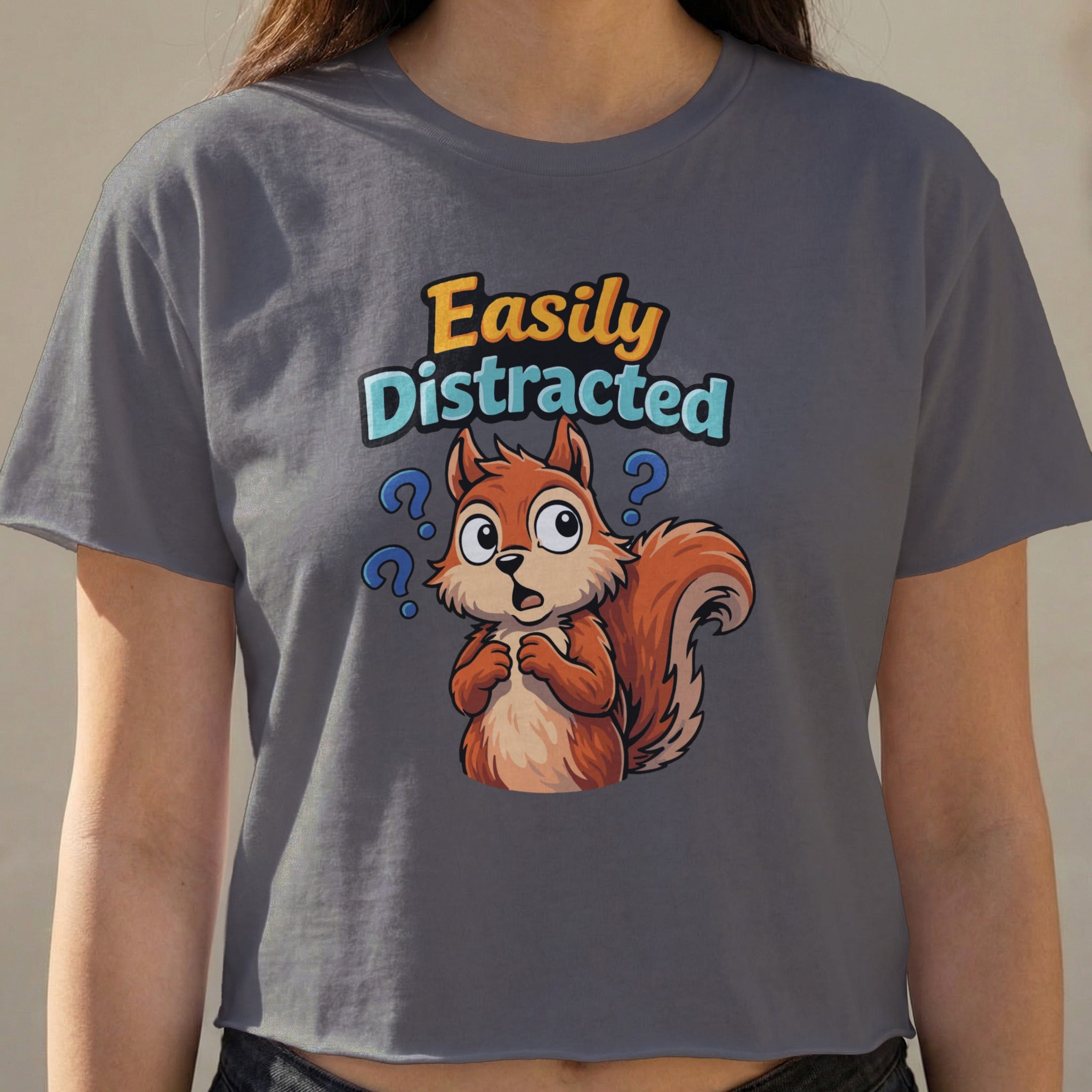 Squirrel with question marks and text "Easily Distracted".