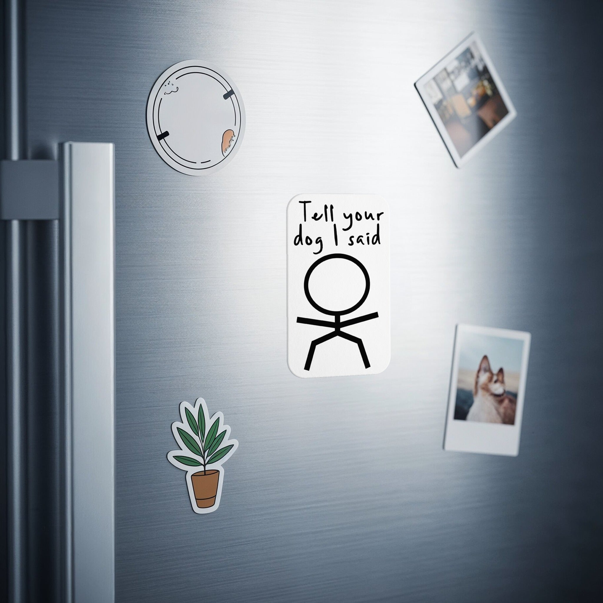 White sticker with stick figure and "Tell your dog I said hi."
