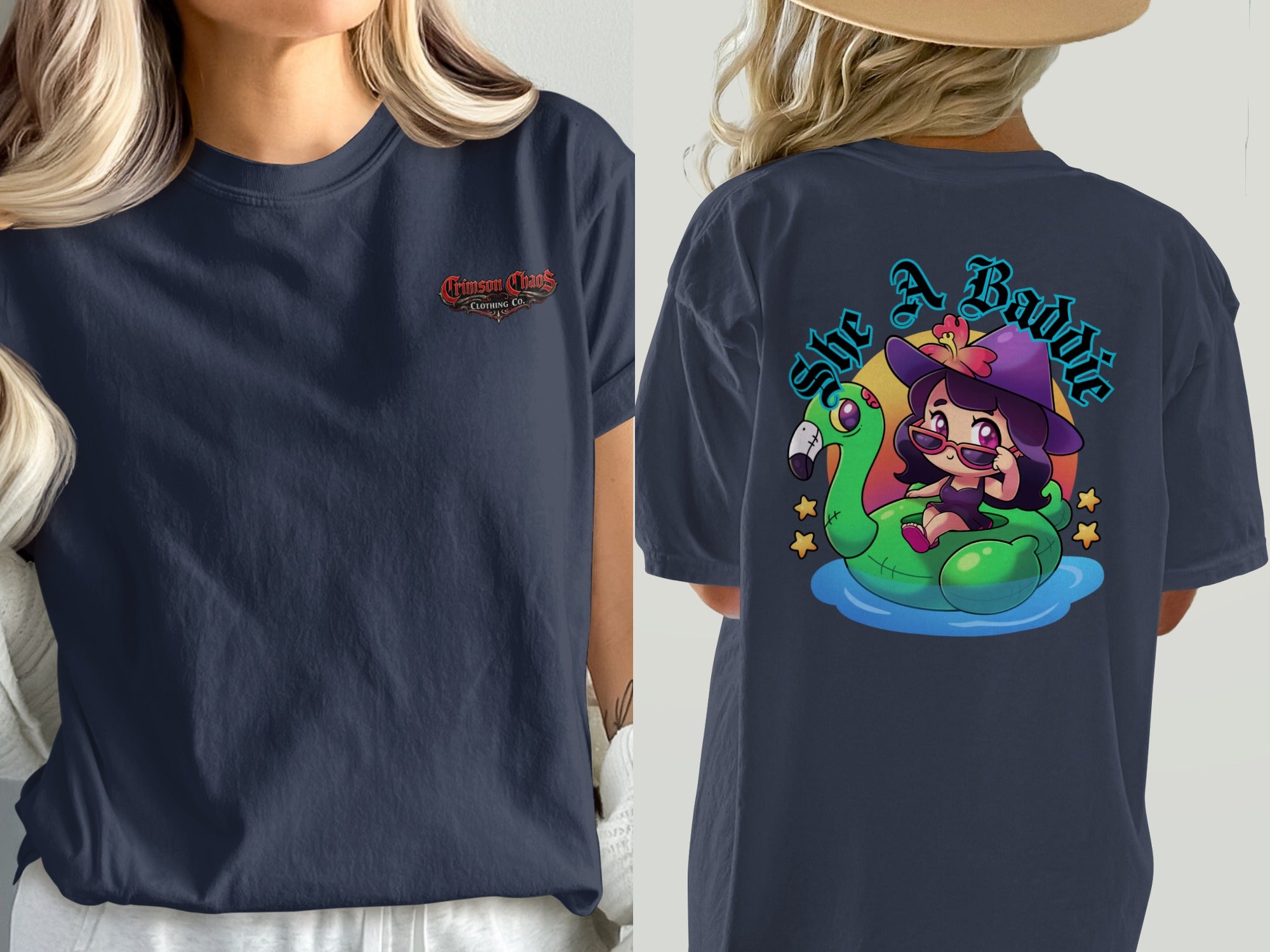 Navy shirt with "Crimson Chaos Clothing Co." logo on front and cartoon witch on flamingo float on back.
