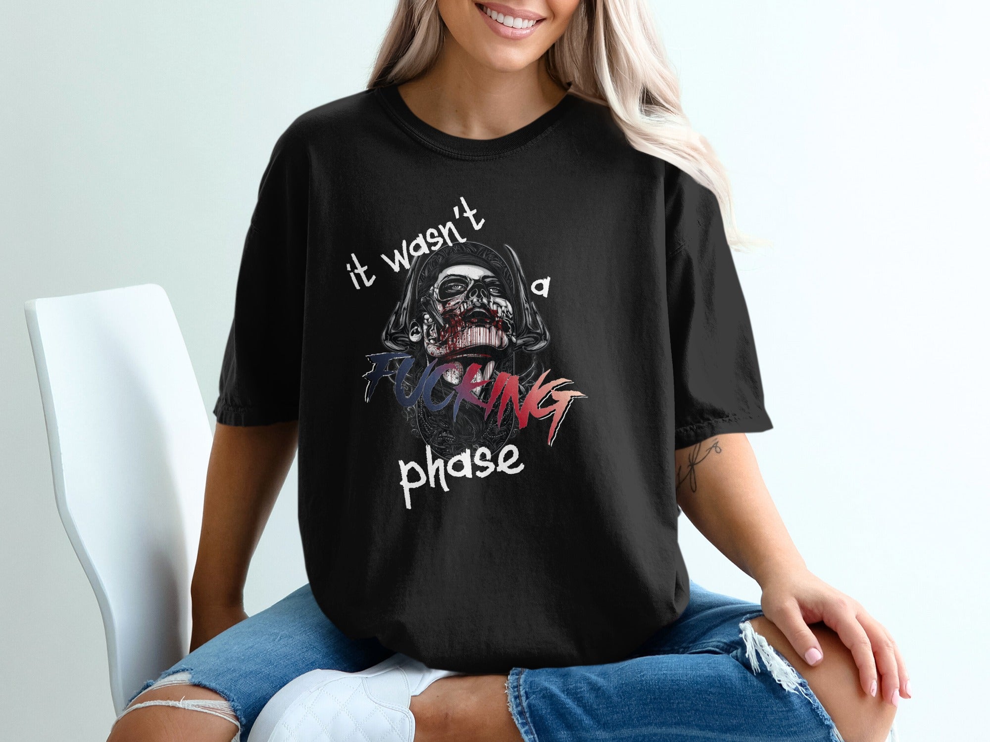 Black t-shirt with "it wasn't a fucking phase" graphic featuring a skull.