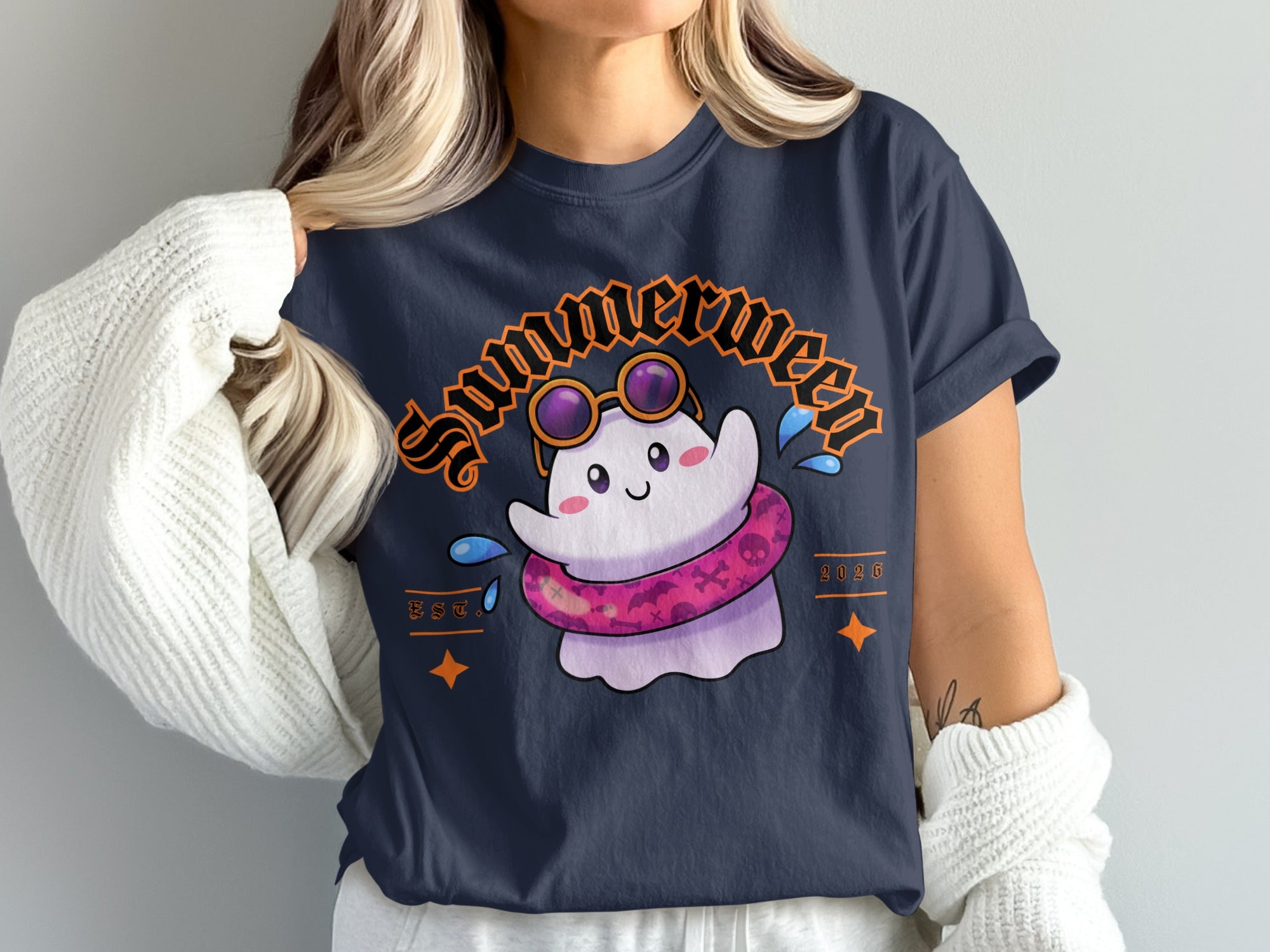 A ghost wearing sunglasses and a floatie on a dark t-shirt.