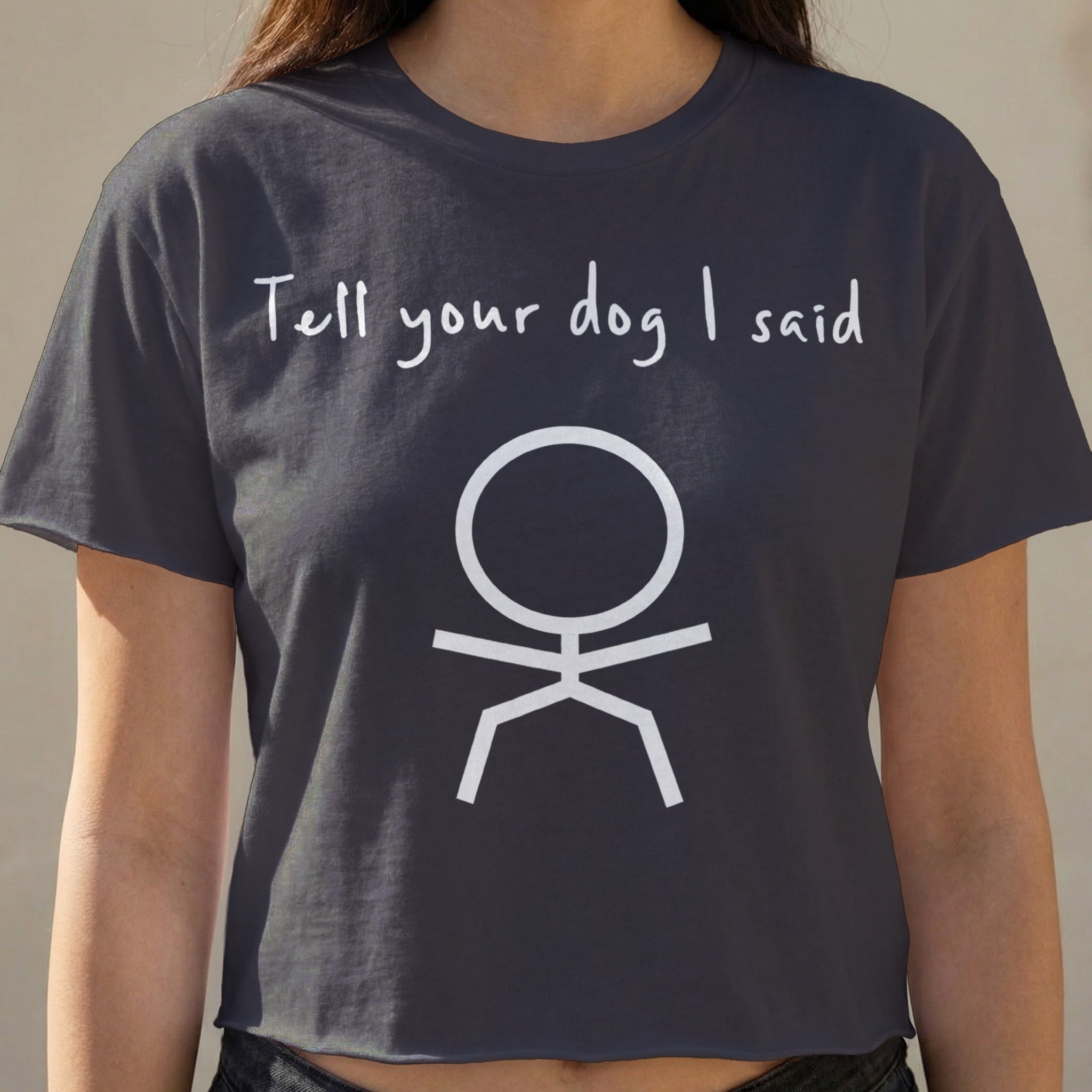 Dark gray cropped t-shirt with "Tell your dog I said" and stick figure graphic.