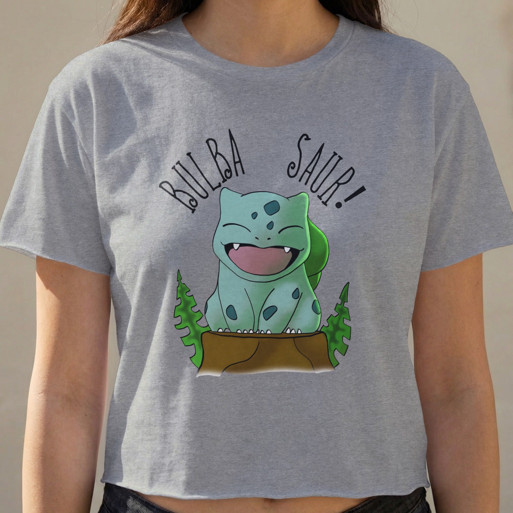 Bulbasaur graphic on a gray crop top with text "BULBA SAUR!"