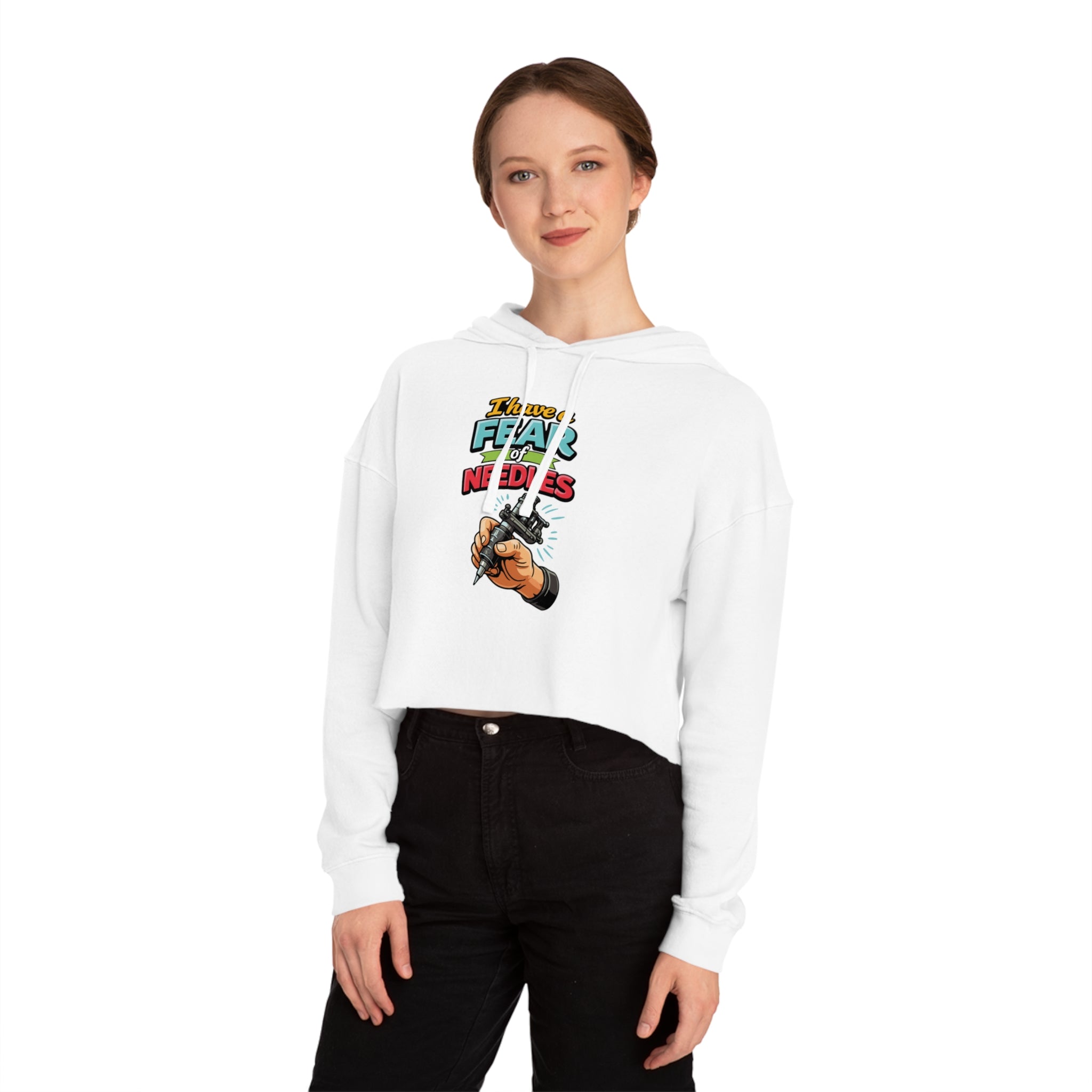 Woman wearing a white crop hoodie with "DON'T FEAR THE NEEDLES" tattoo graphic.