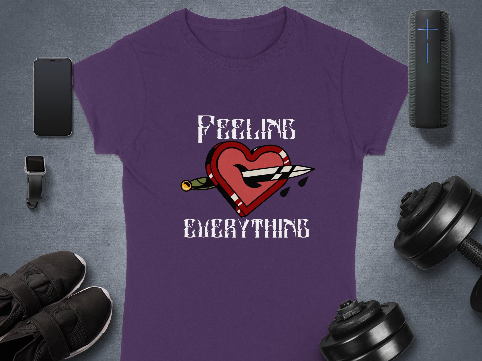 Purple t-shirt with heart, knife, and "FEELING EVERYTHING" text.