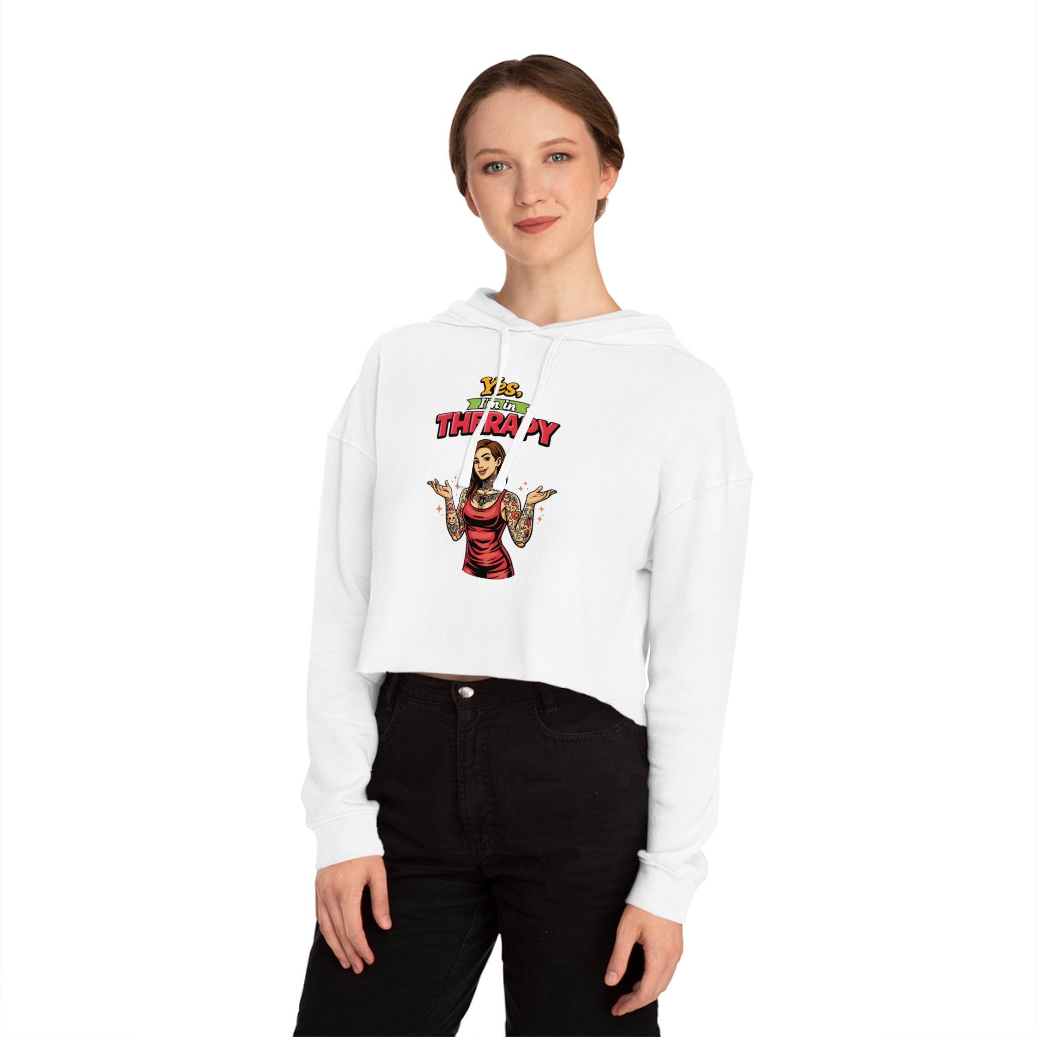 Woman in white crop hoodie with "YOLO THERAPY" text and graphic.