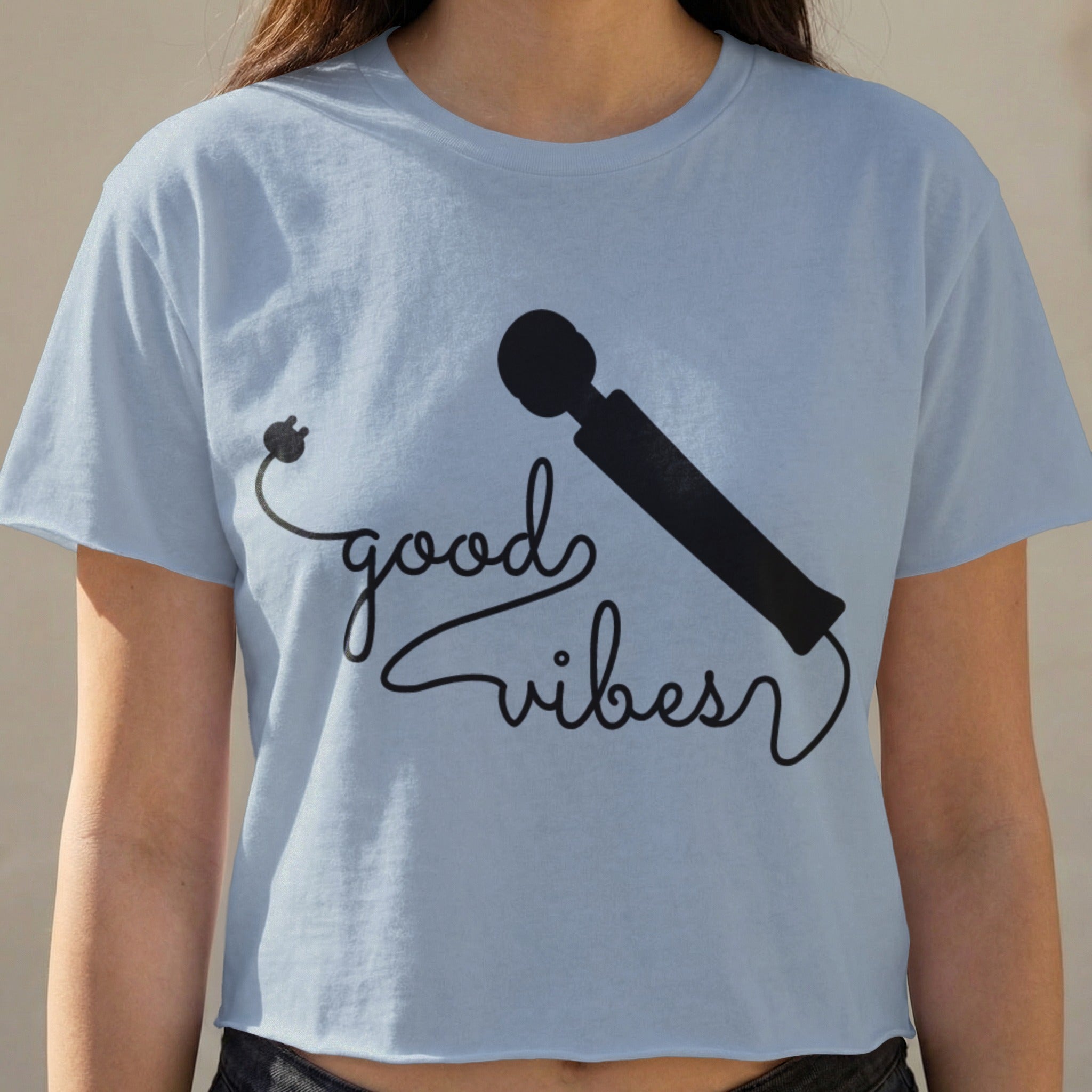 Light blue crop top with black "good vibes" text and a vibrator graphic.