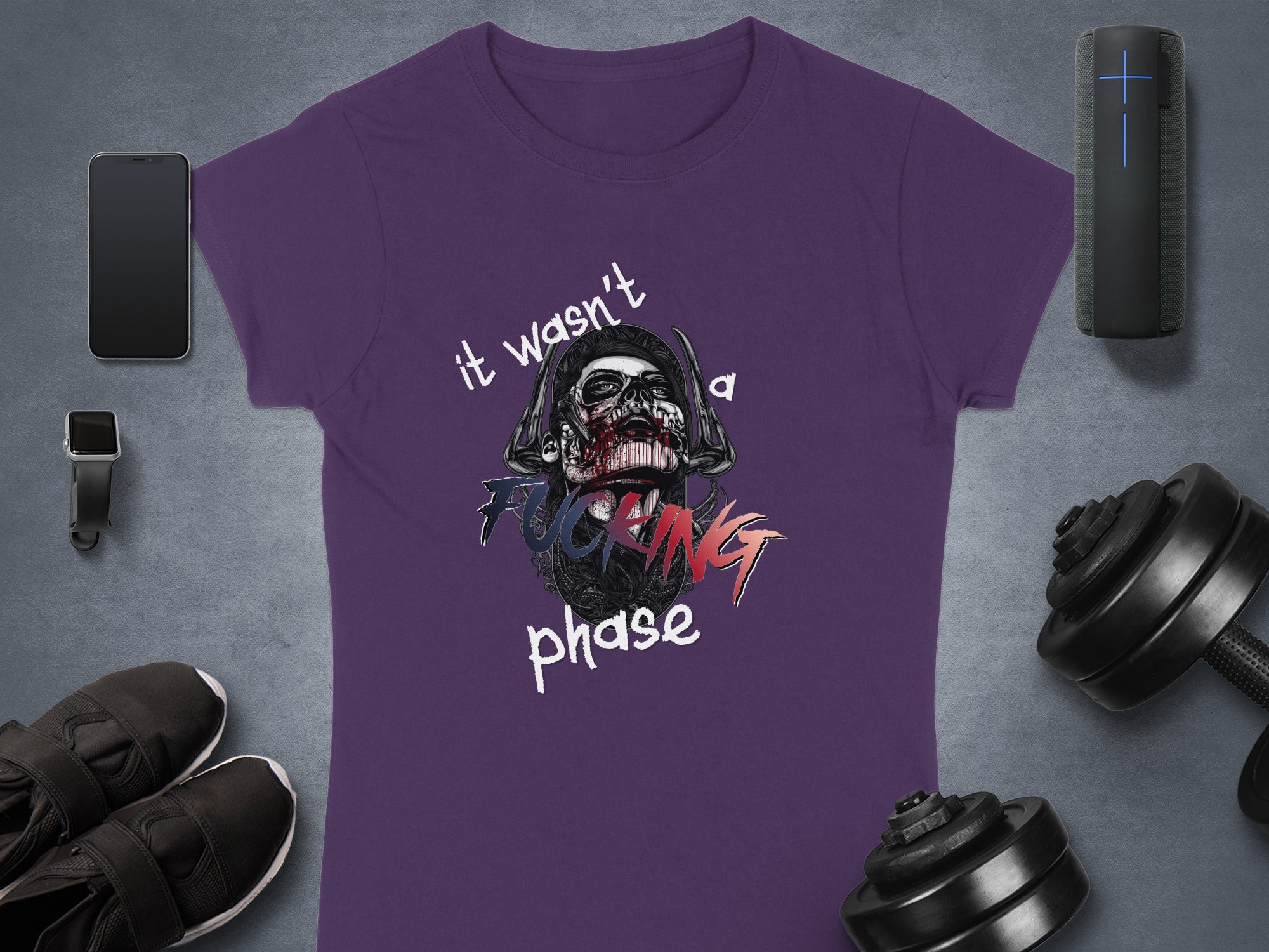 Purple t-shirt with skull graphic and "it wasn't a fucking phase" text.