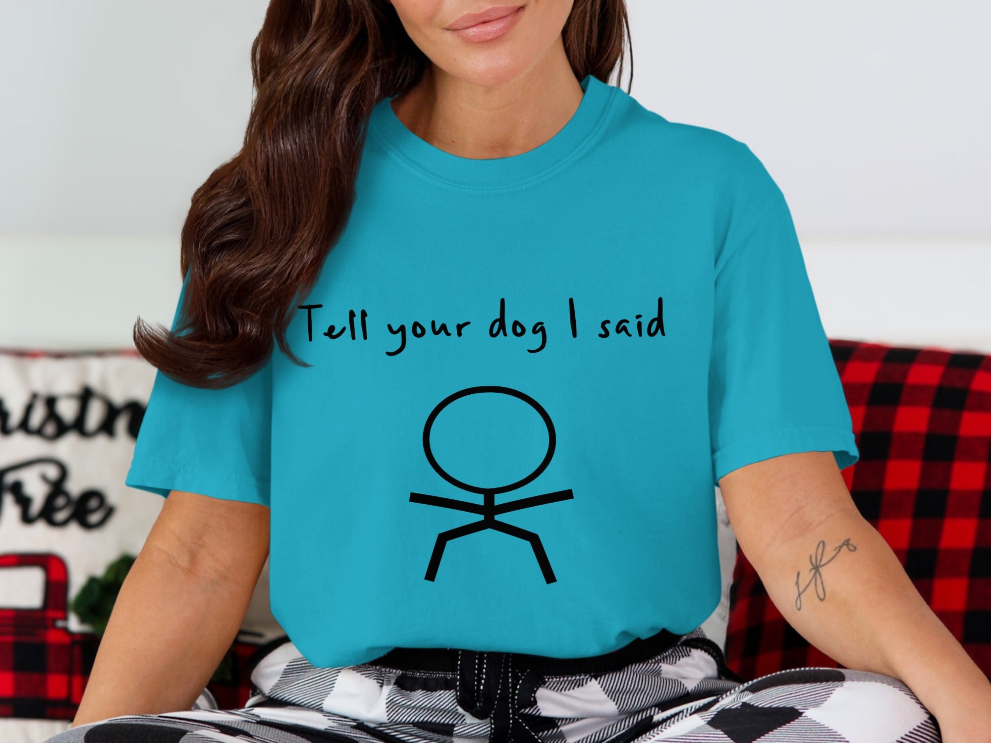 Turquoise t-shirt with stick figure and "Tell your dog I said" text.