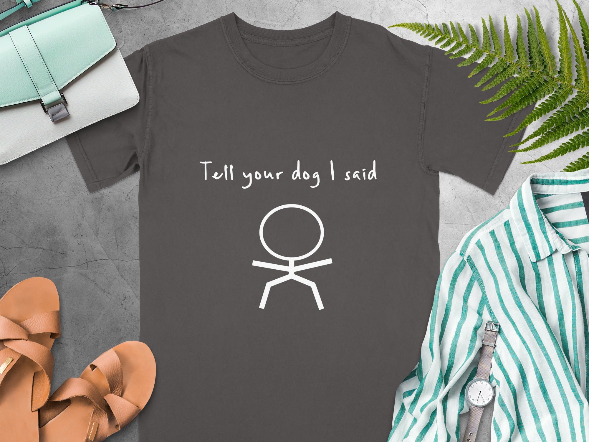 Dark grey t-shirt with "Tell your dog I said" and a stick figure.