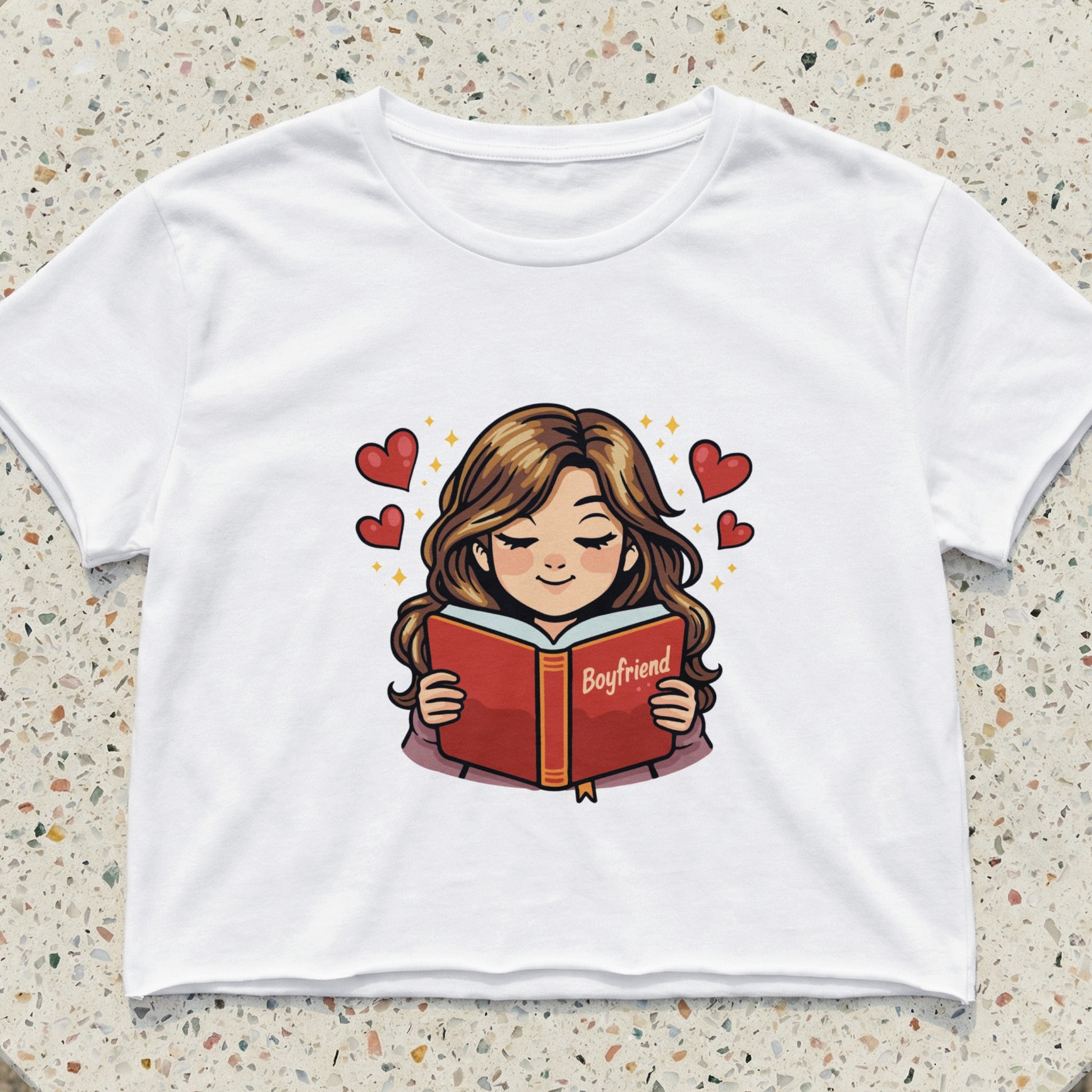 Cartoon girl reading a book titled "Boyfriend" with hearts floating around her.