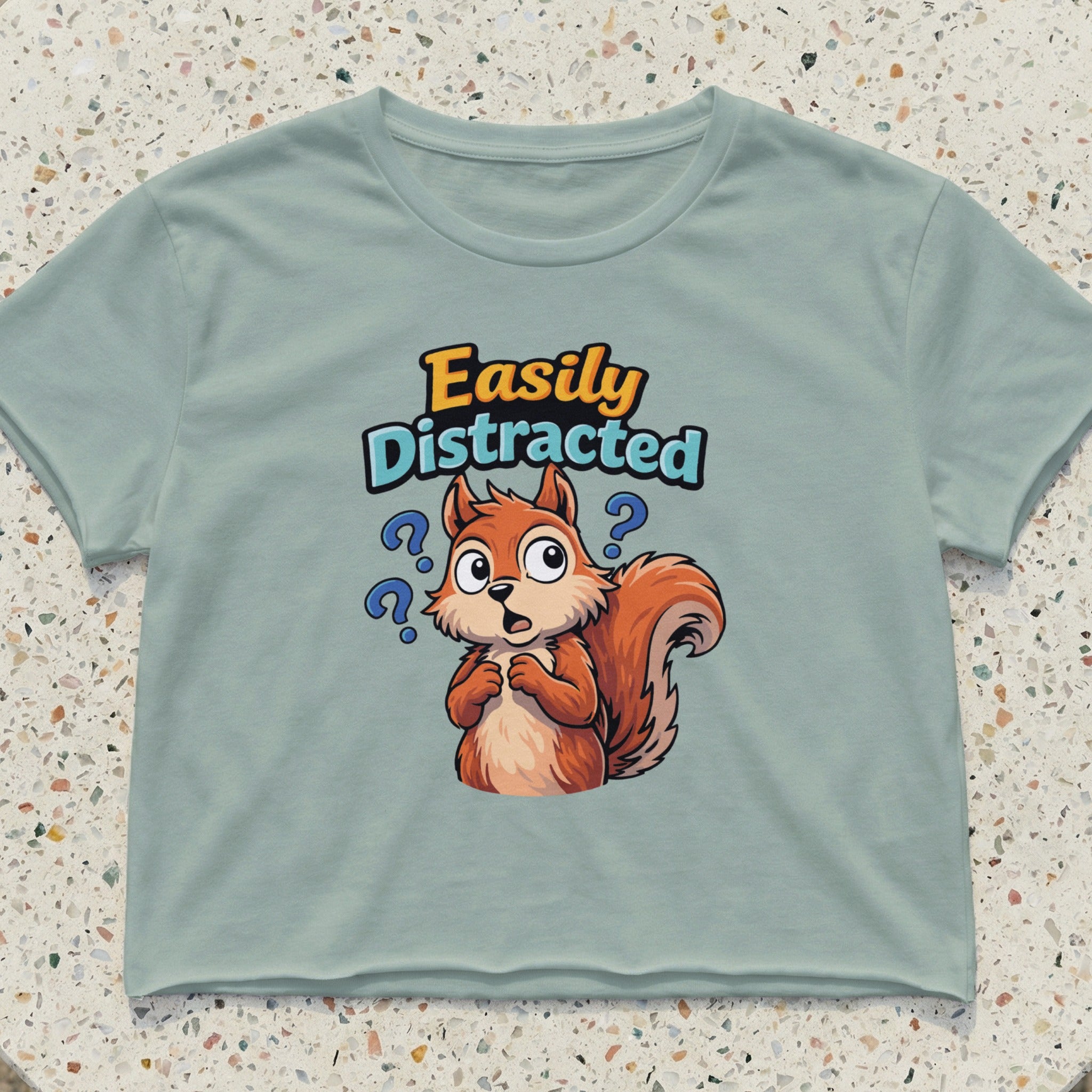 Cropped t-shirt with cartoon squirrel and text "Easily Distracted".