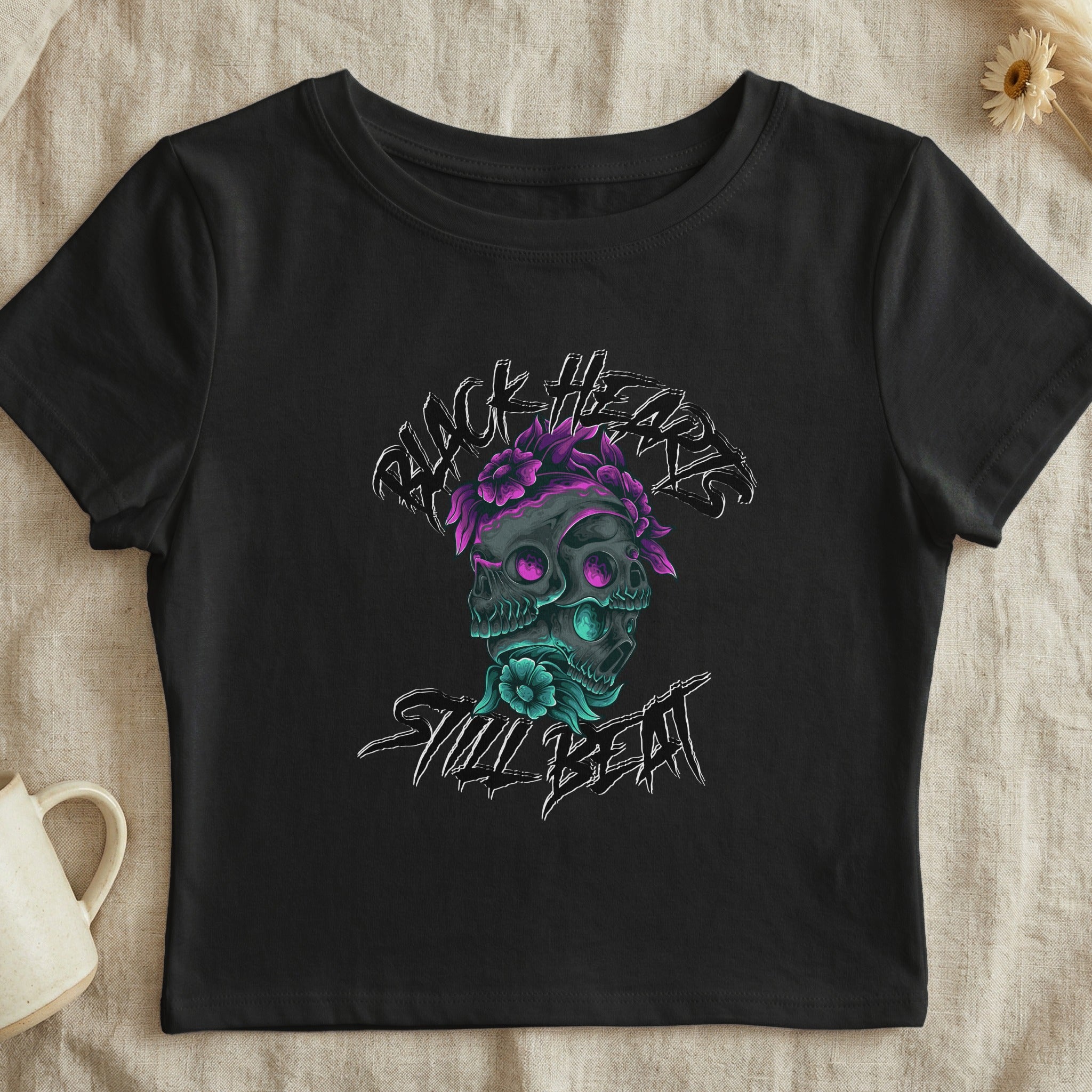 Black crop top with skull and floral graphic and "Skull Beat" text.