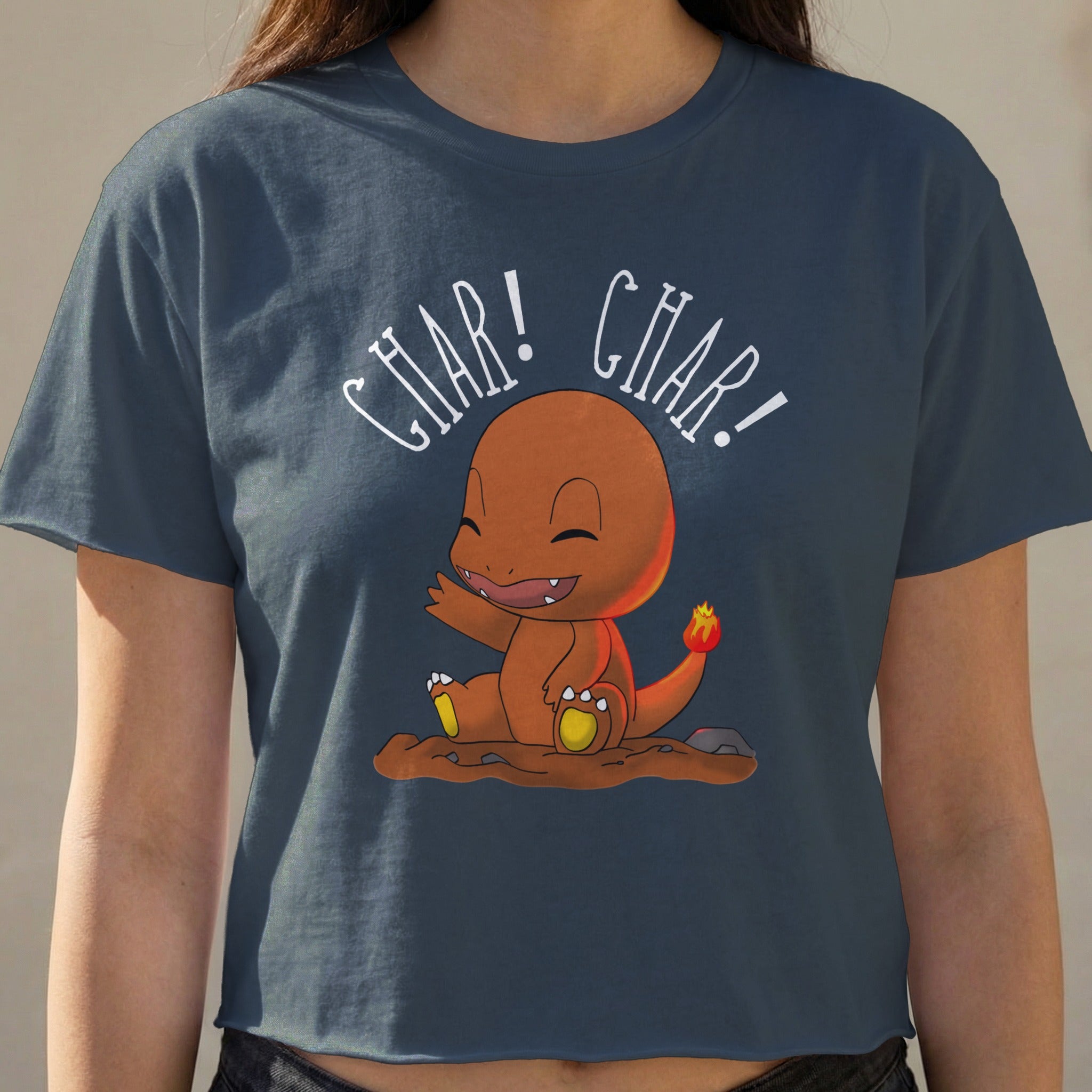 Charmander character on a navy t-shirt with "CHAR! CHAR!" text.