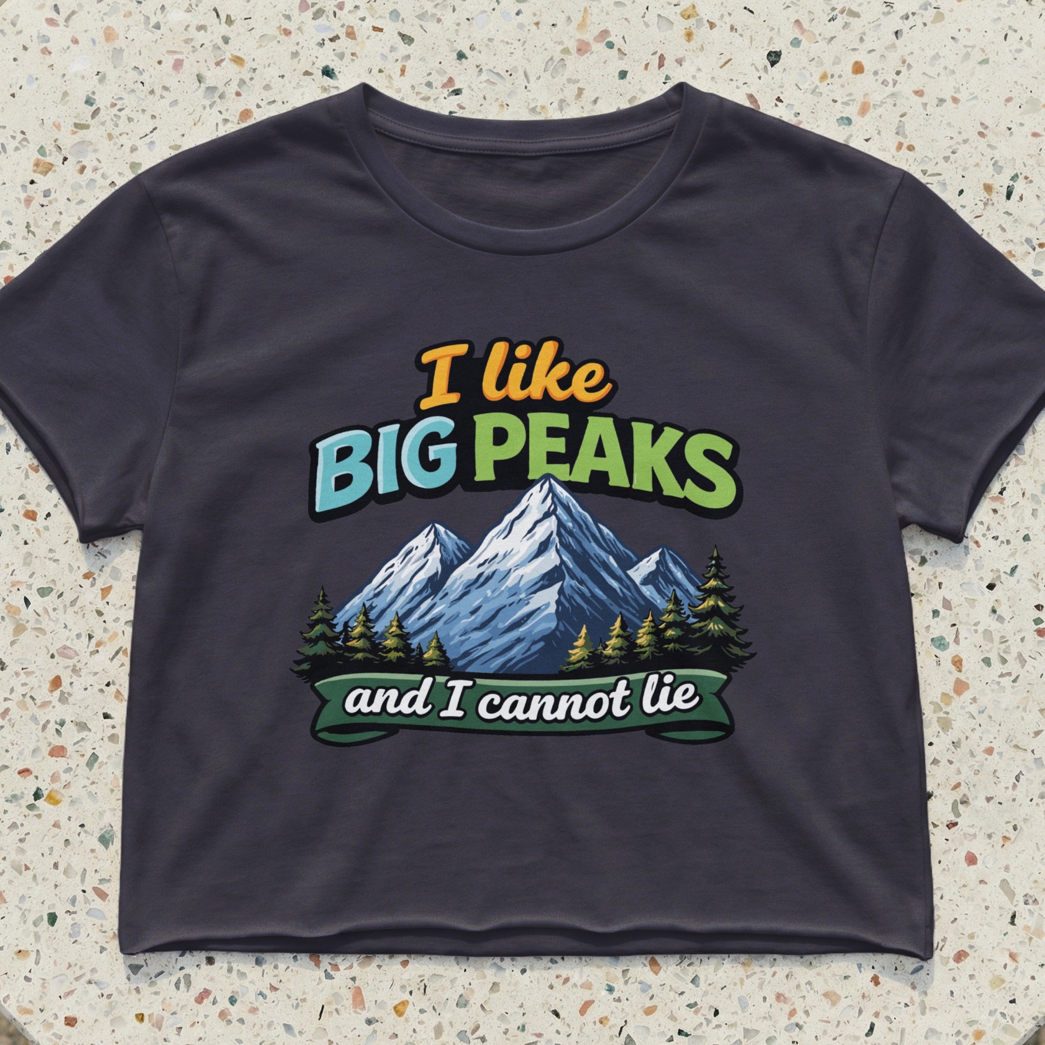 T-shirt with "I like BIG PEAKS and I cannot lie" text and mountain graphic.