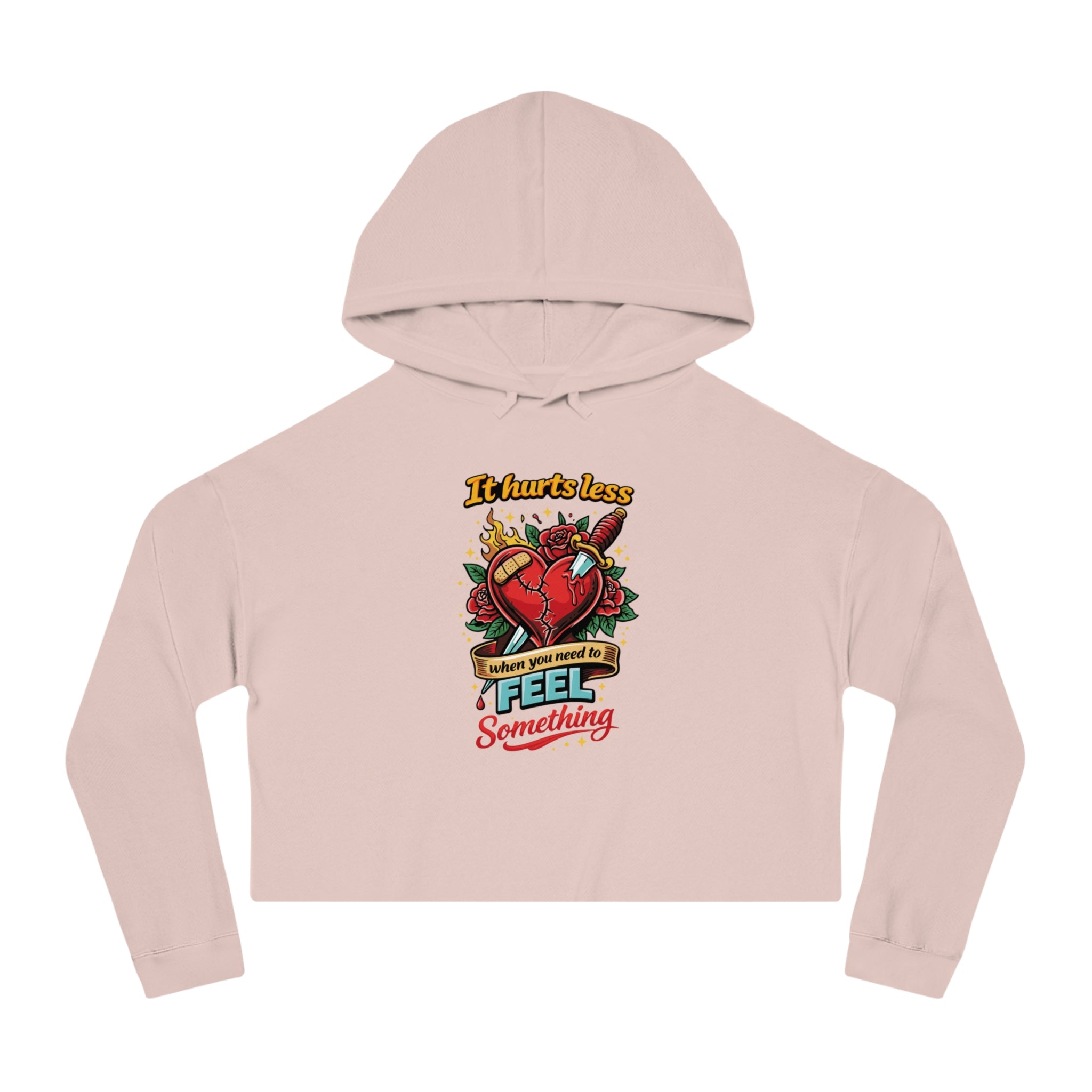 Pink cropped hoodie with a graphic of a broken heart with a knife and text.
