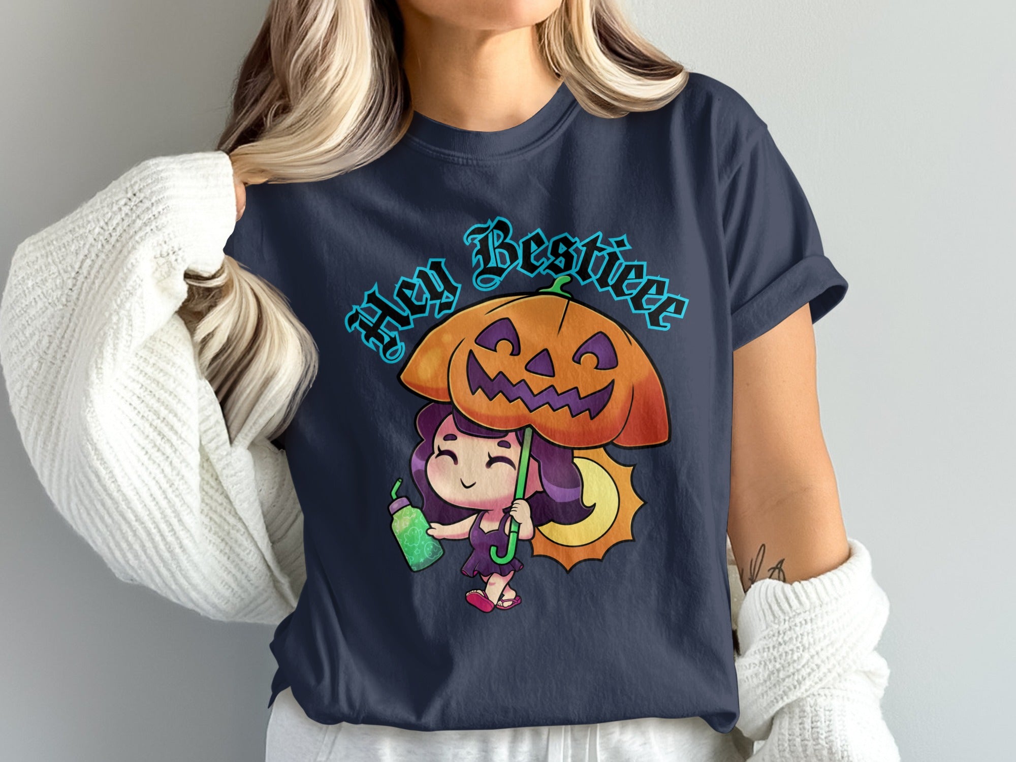 T-shirt graphic: "Hey Bestie" text, a cartoon witch with a jack-o'-lantern umbrella.
