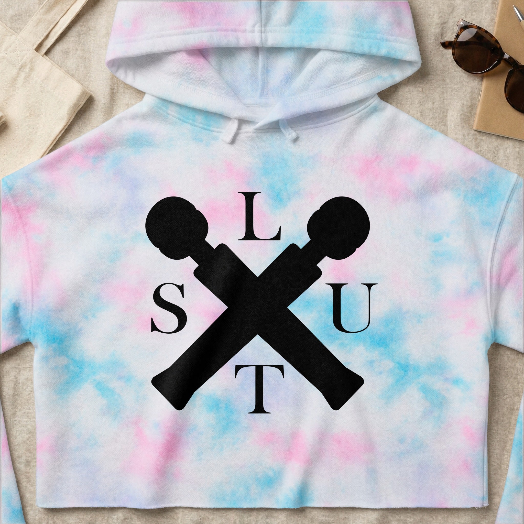 Cropped tie-dye hoodie with "SLUT" text and crossed microphone icons.