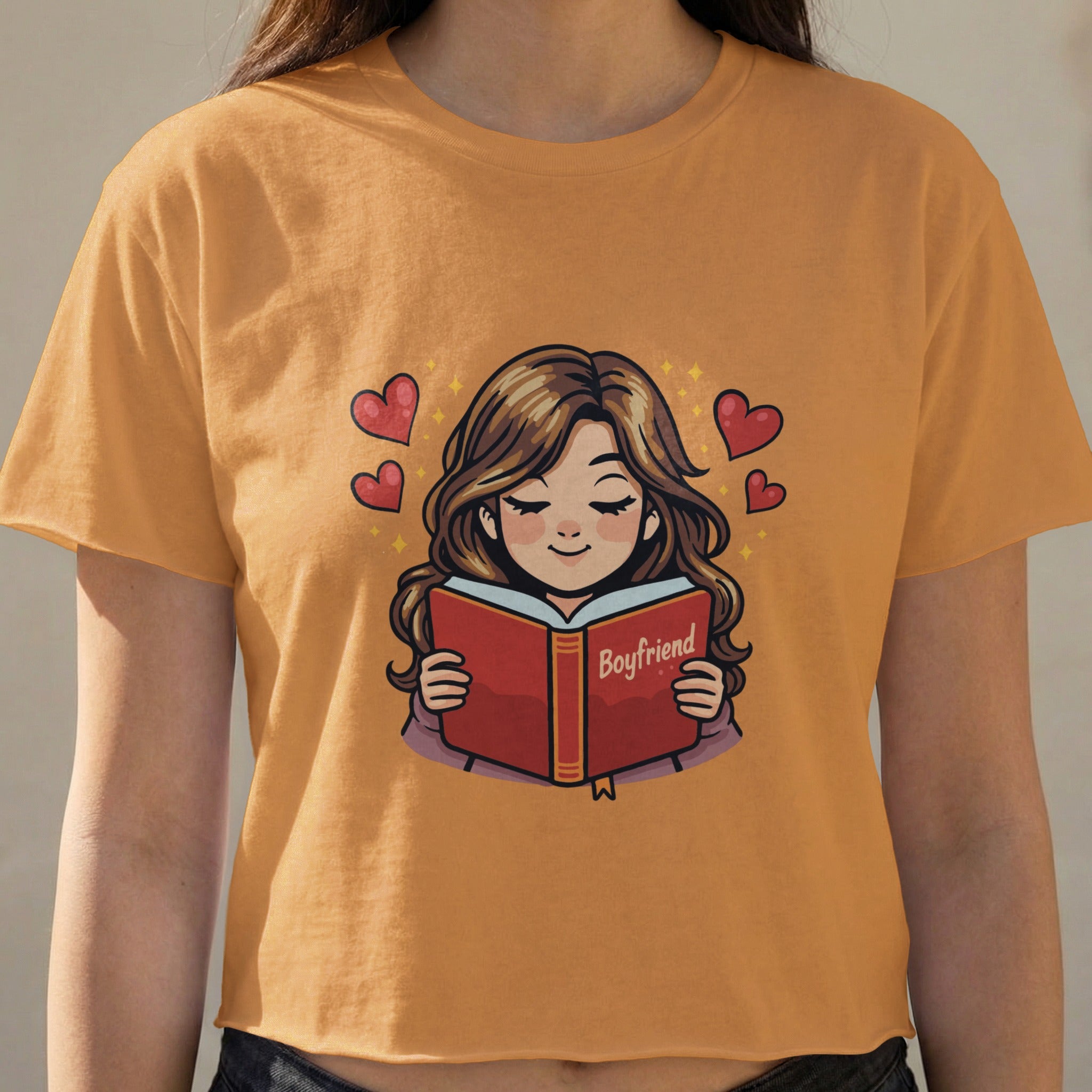 Girl reading a book titled "Boyfriend" with hearts.