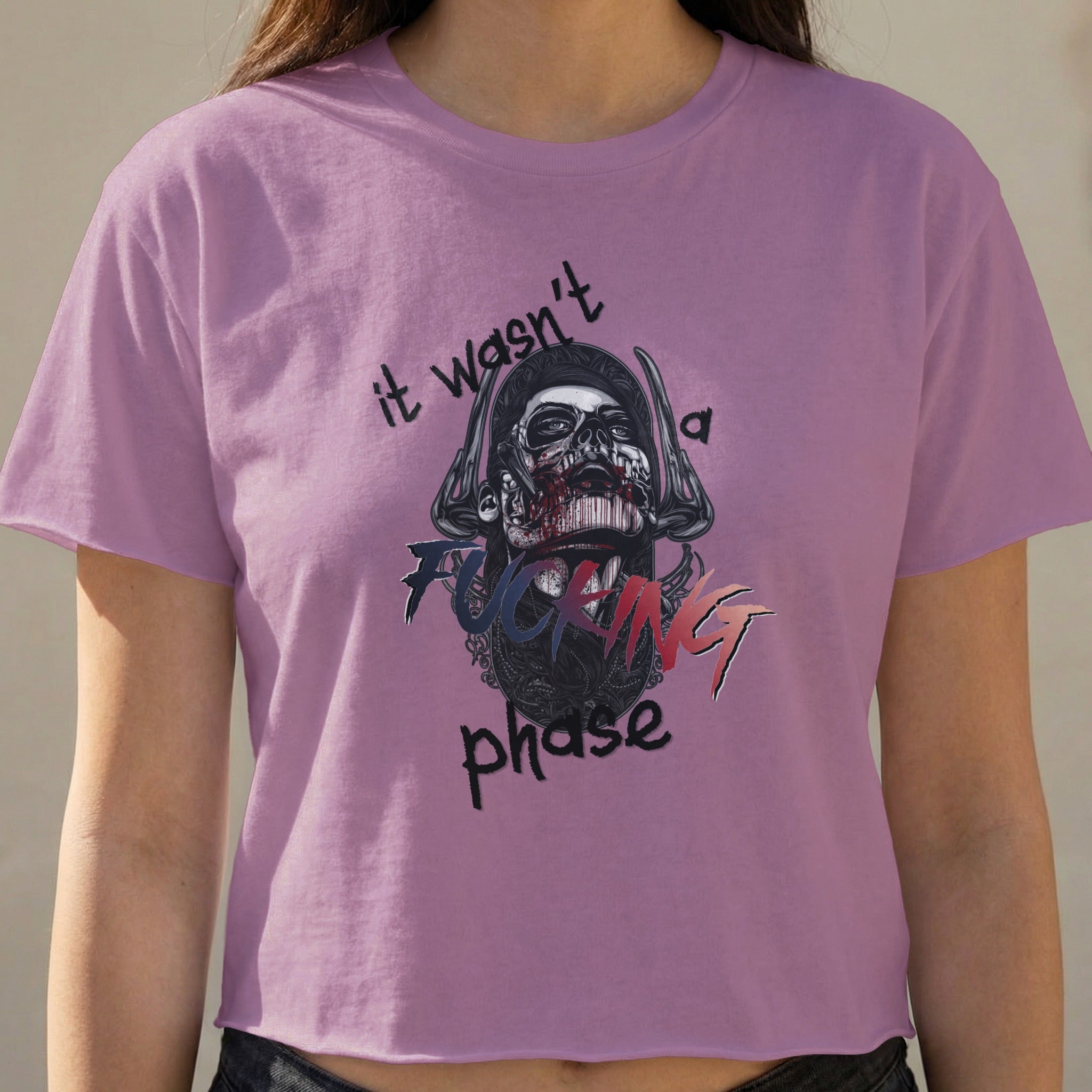 Purple t-shirt with skull graphic and text: "it wasn't a FUCKING phase".