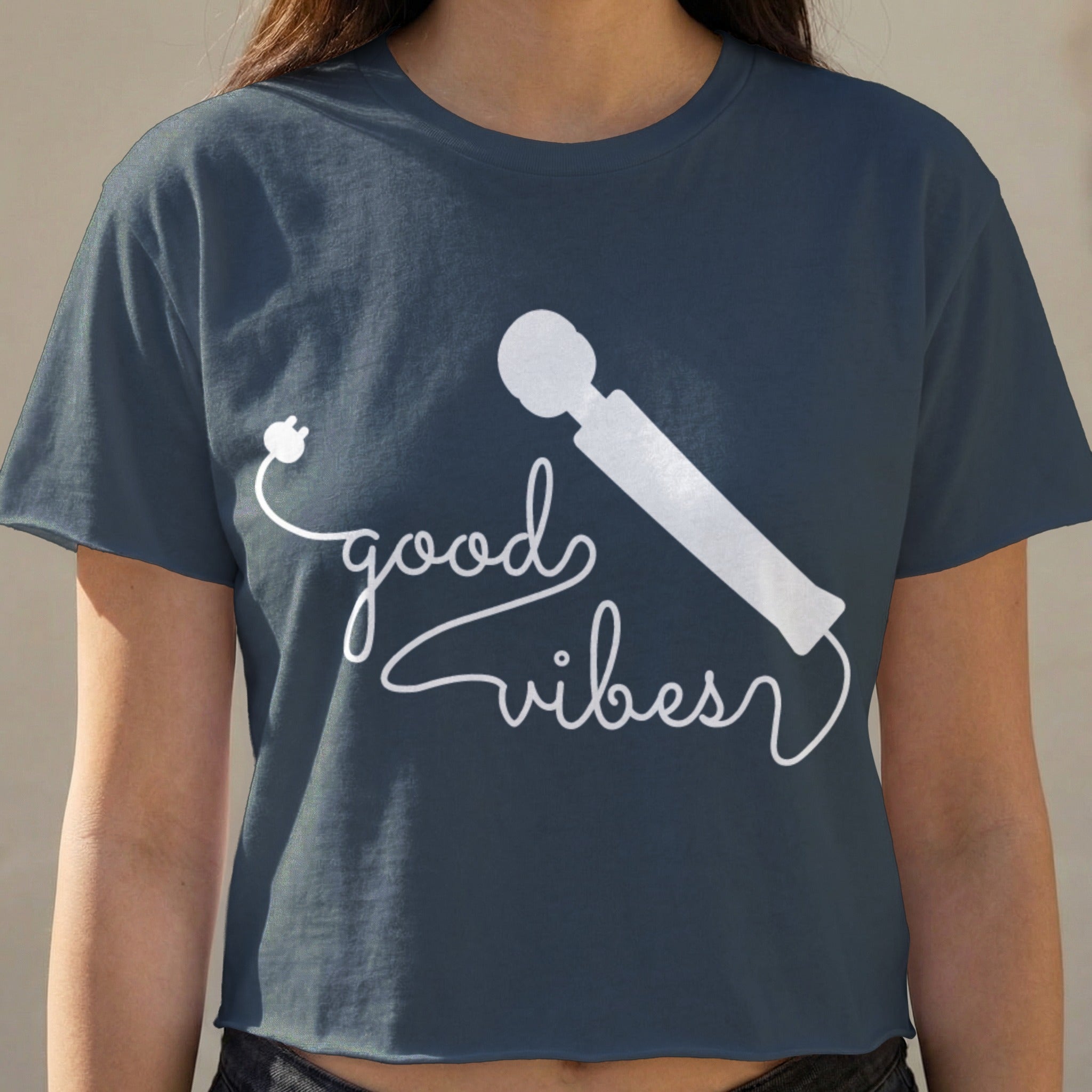 Dark blue t-shirt with white "good vibes" text and a silhouette of a wand massager.