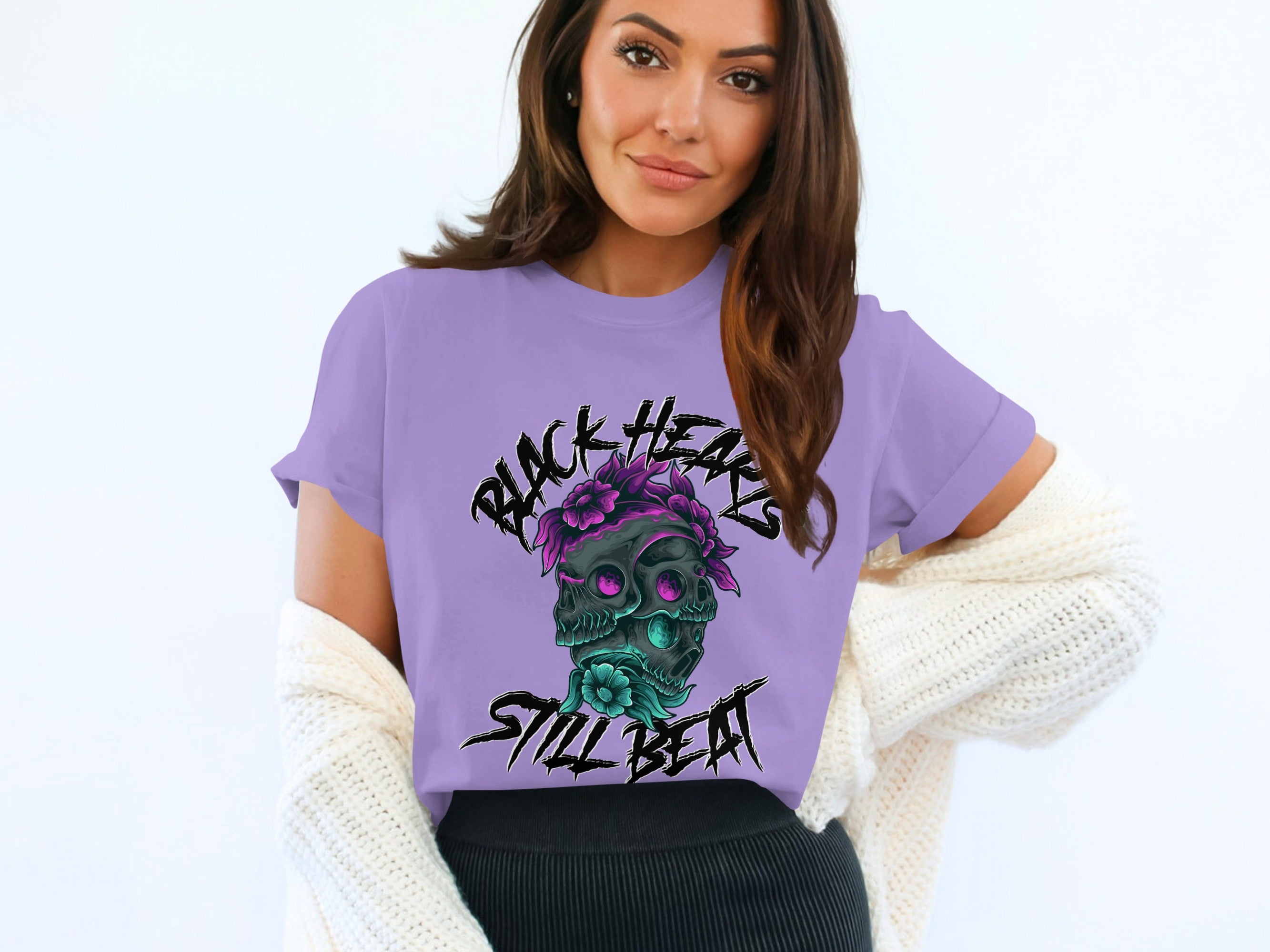 Purple t-shirt with black hearts and skull graphic, "Black Hearts Still Beat" text.