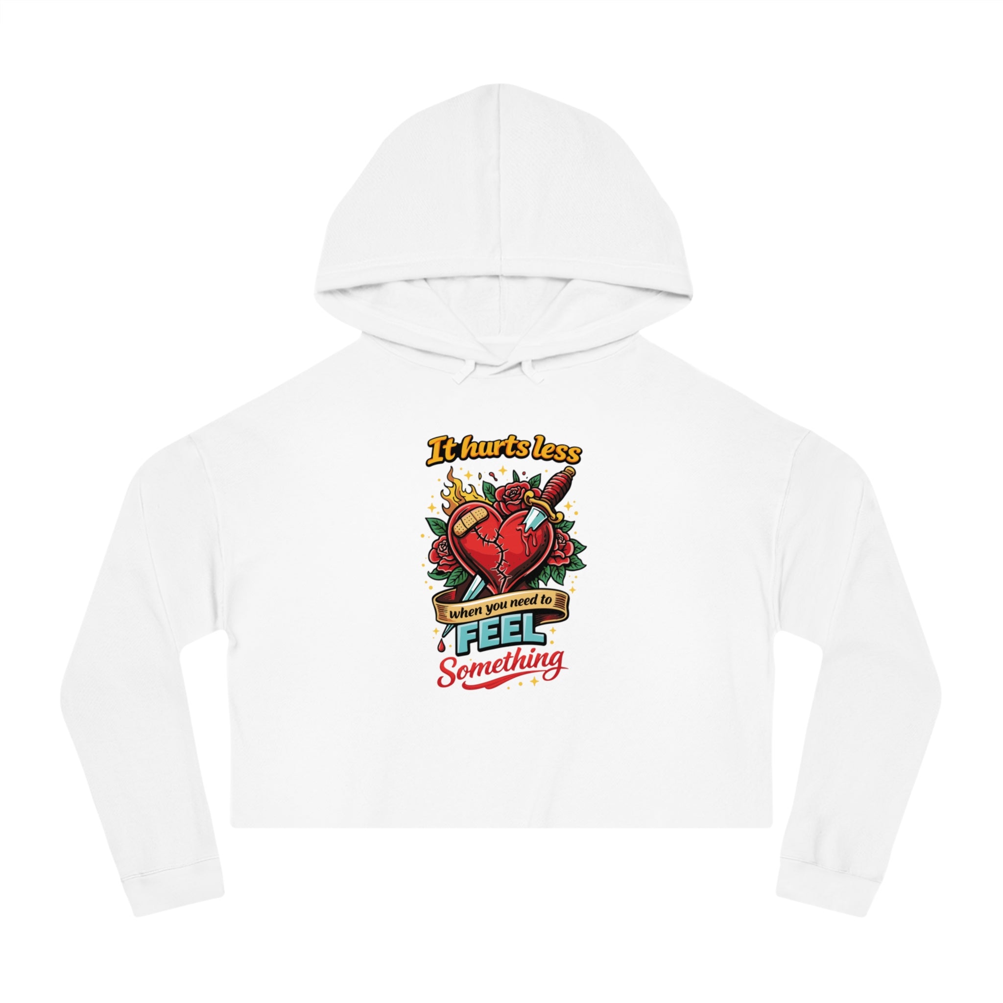 White cropped hoodie with "It hurts less when you need to feel something" text and heart graphic.