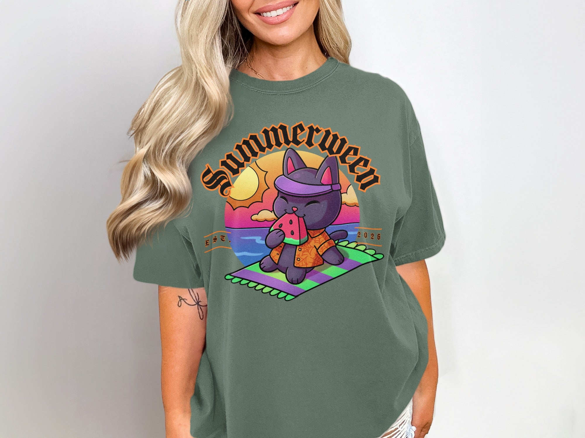 T-shirt graphic: purple cat with bandana eating watermelon on beach, "Summerween" text.