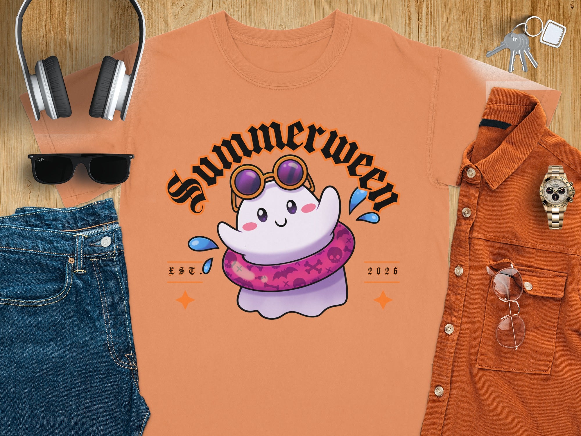 Orange t-shirt with a cute ghost wearing sunglasses and a pink inner tube.