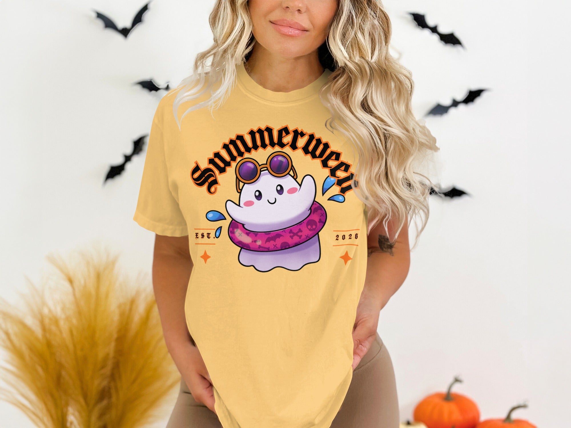 Yellow t-shirt with a cartoon ghost wearing sunglasses and a float, text reads "Summerween EST. 2026".