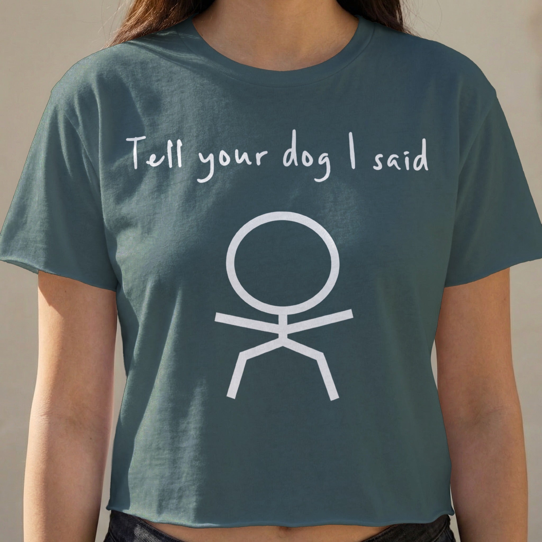 Cropped t-shirt with "Tell your dog I said" and a stick figure.