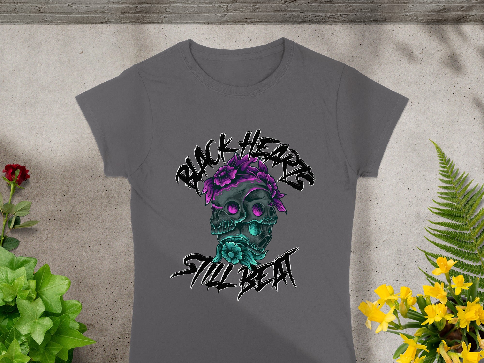 Grey t-shirt with "BLACK HEARTS STILL BEAT" text and skull graphic.