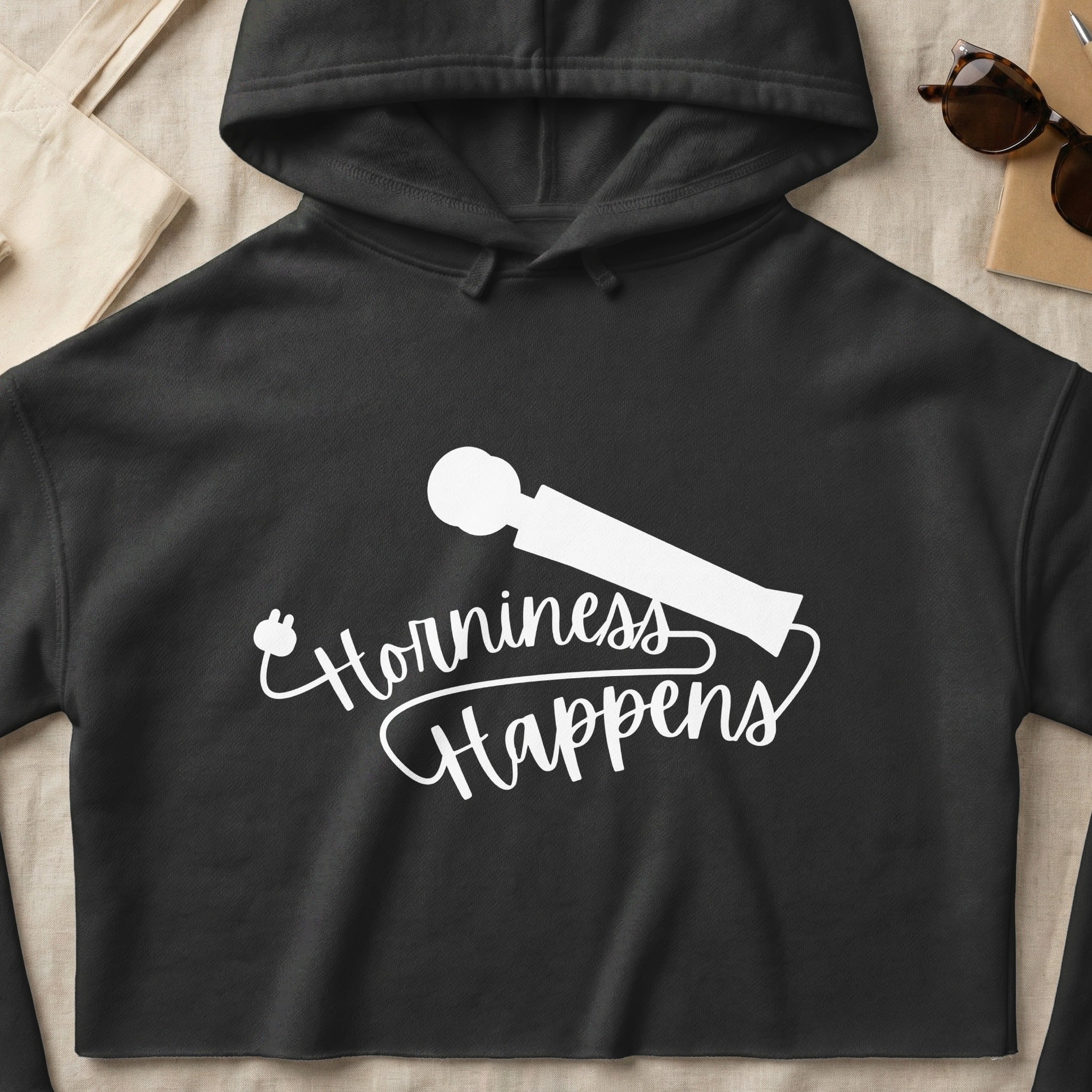 Black hoodie with white text "Horniness Happens" and a silhouette of a vibrator.