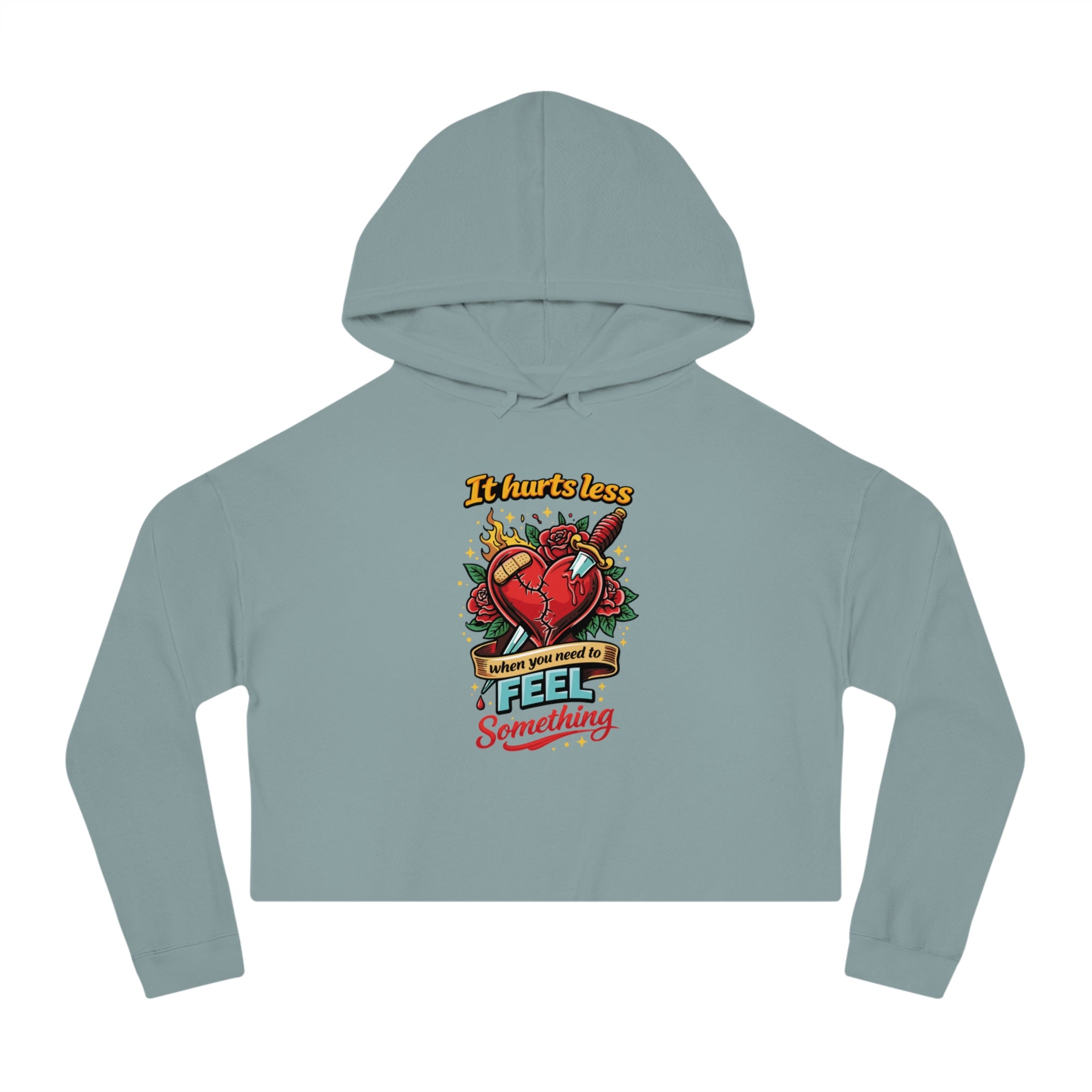 Cropped hoodie with "It hurts less when you need to feel something" text and heart tattoo design.