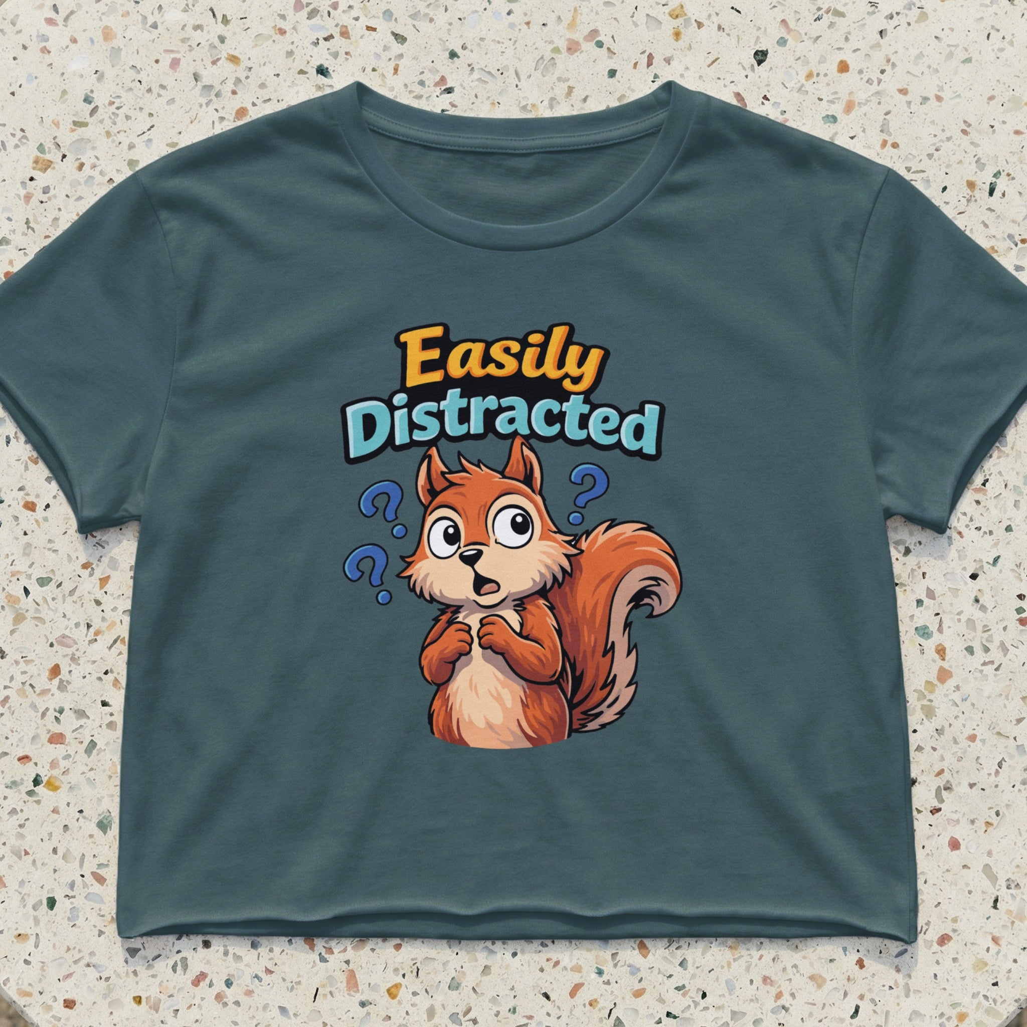 Blue t-shirt with cartoon squirrel and text "Easily Distracted".