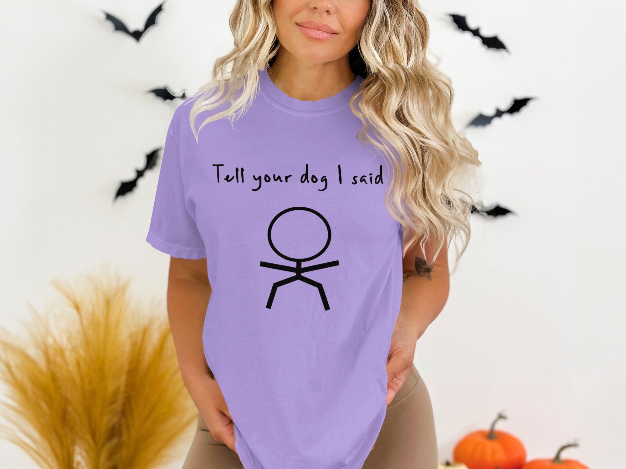 Lavender t-shirt with stick figure and "Tell your dog I said" text.