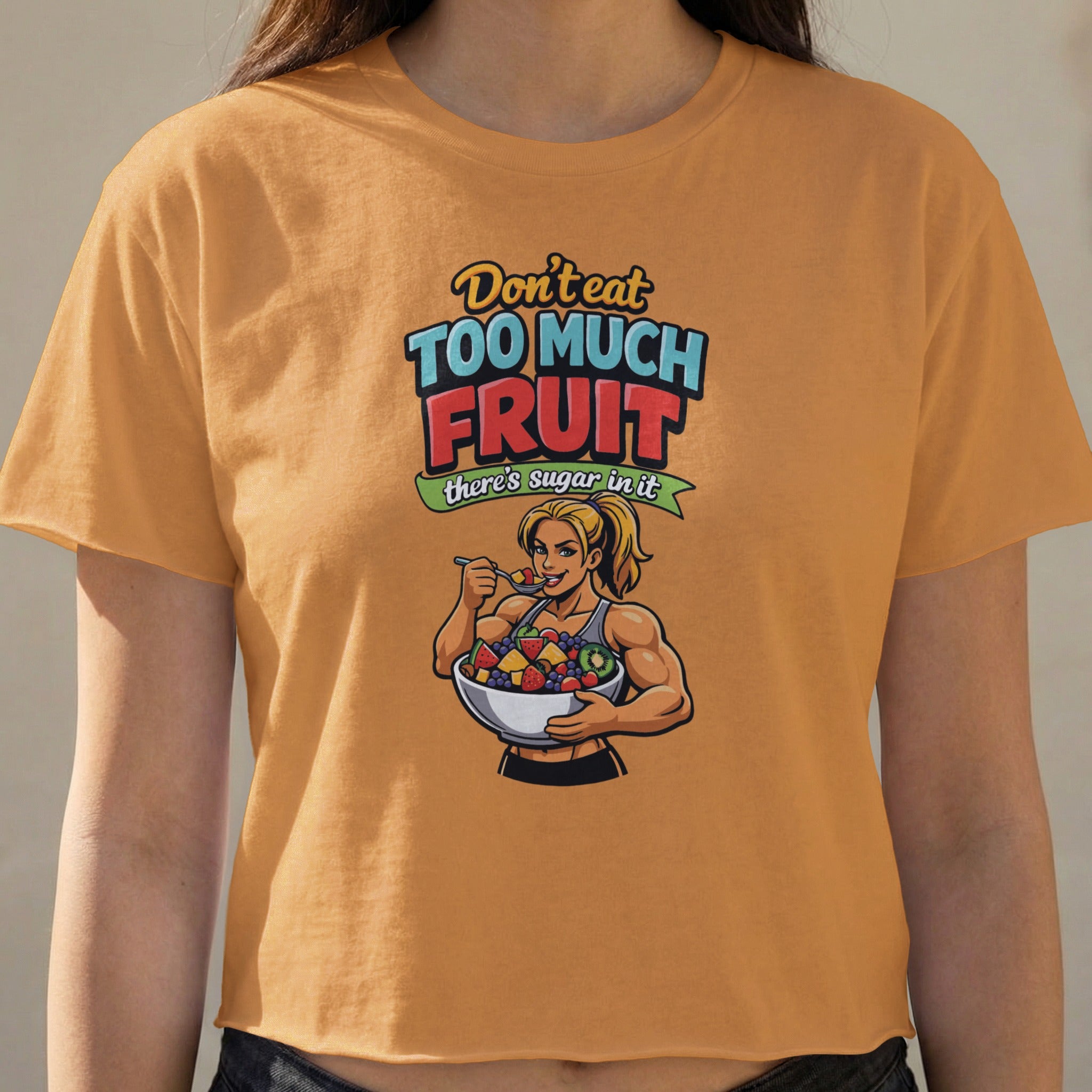 Woman in orange shirt holding bowl of fruit with text "Don't eat too much fruit there's sugar in it".