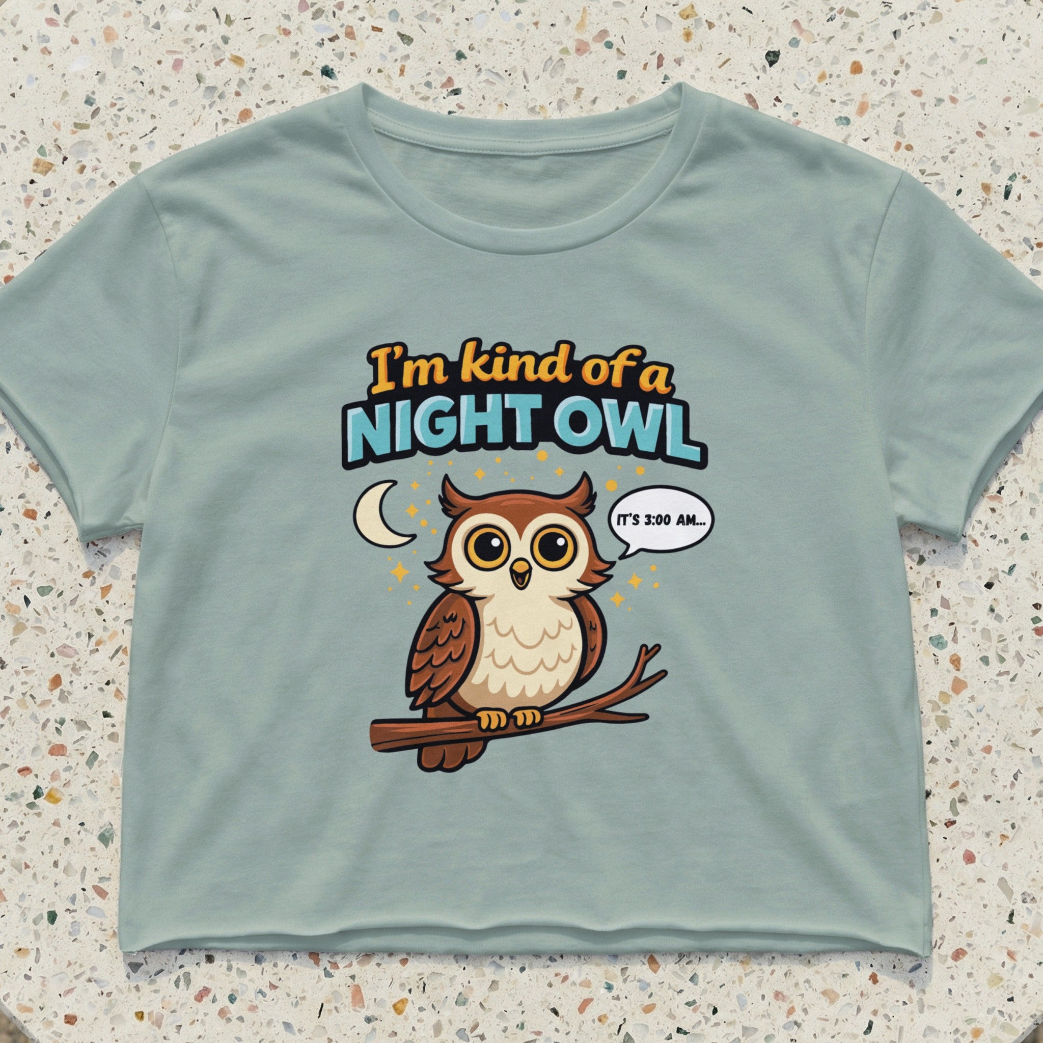 Light blue crop top with cartoon owl saying "I'm kind of a night owl. It's 3:00 AM."