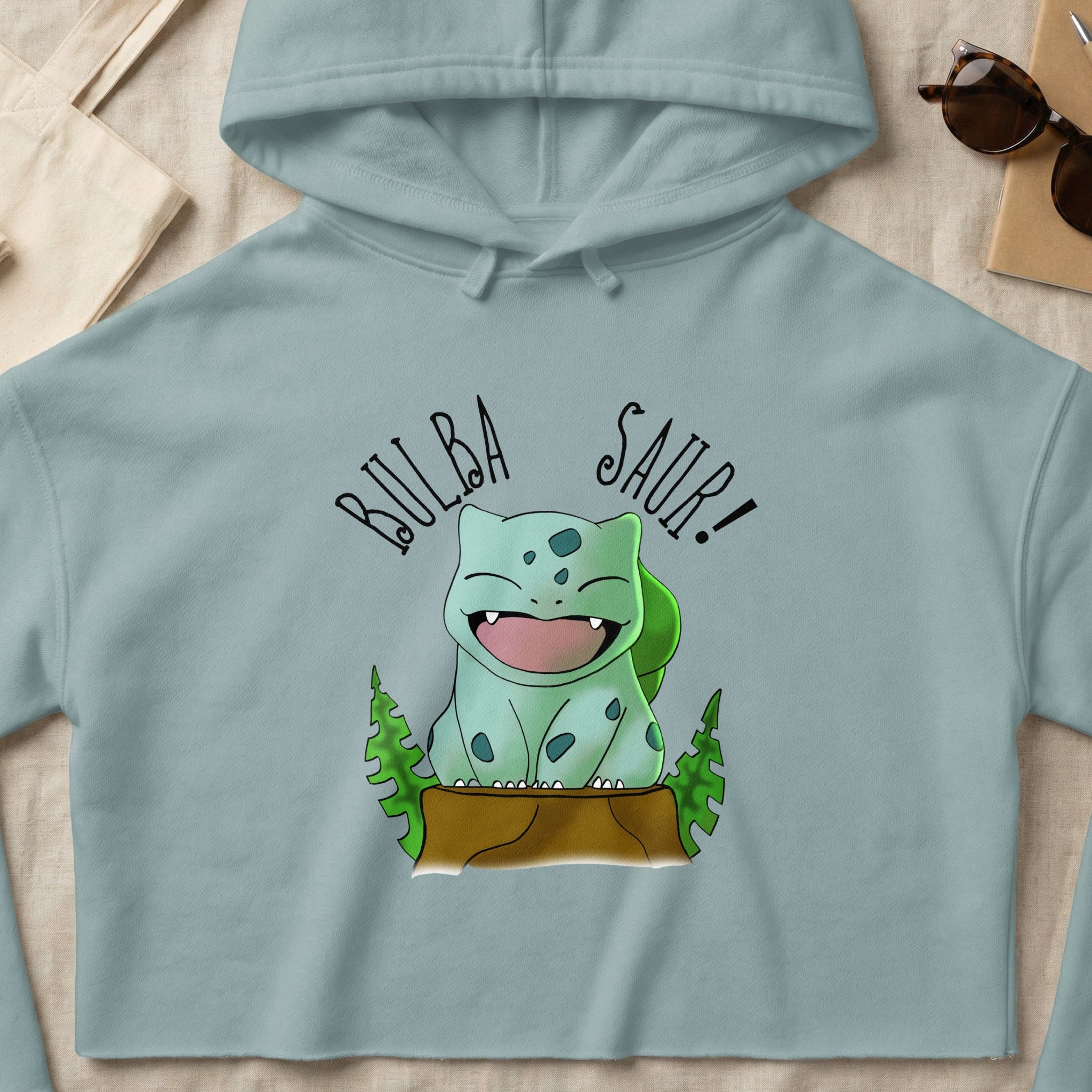 Bulbasaur graphic on cropped grey hoodie with text "BULBA SAUR!".