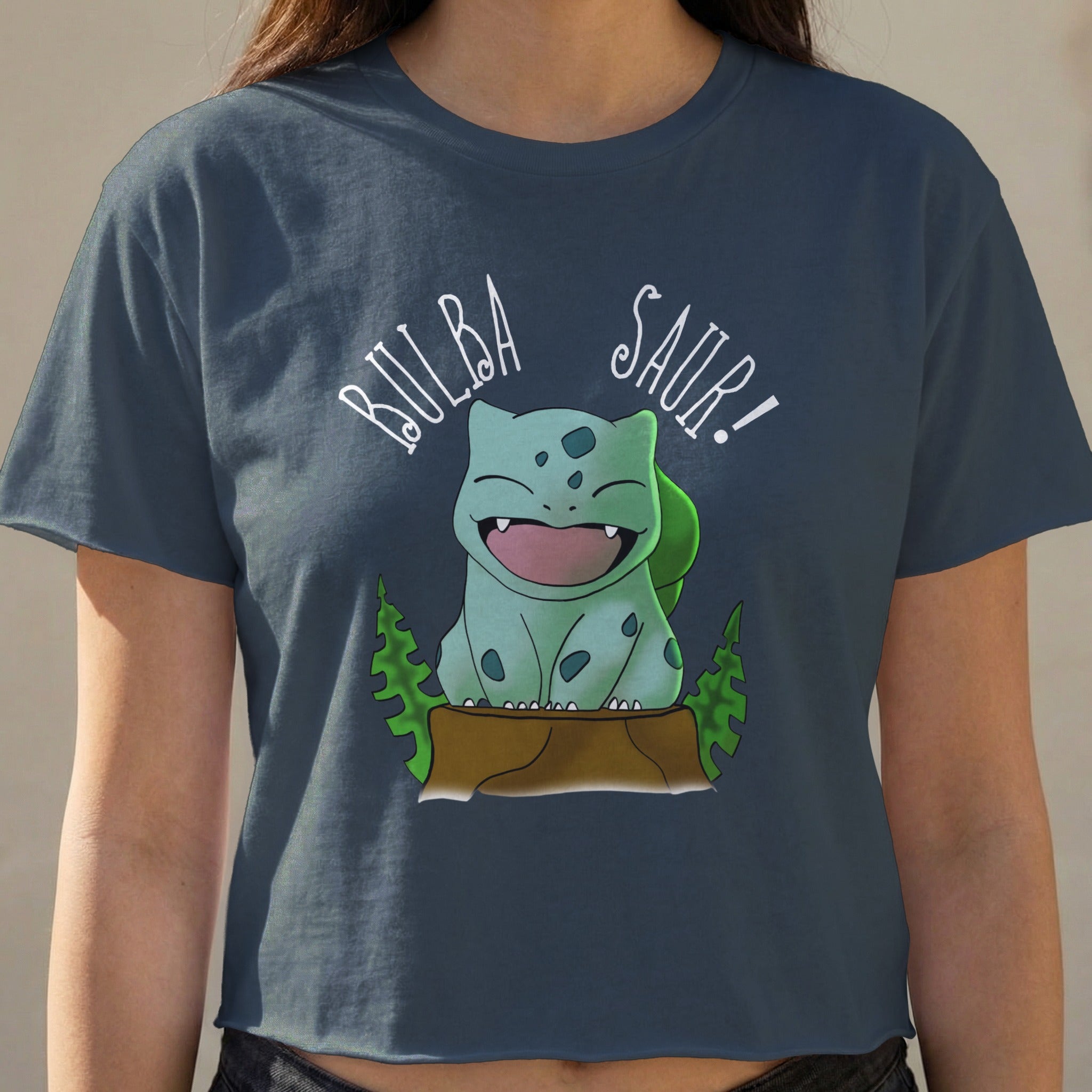 Bulbasaur graphic and text "Bulba Saur!" on a dark blue crop top.
