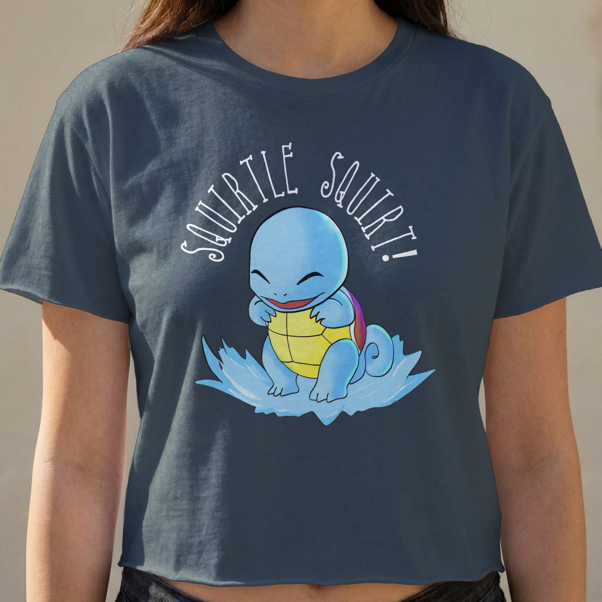 Squirtle graphic on dark blue cropped t-shirt with "Squirtle Squirt!" text.