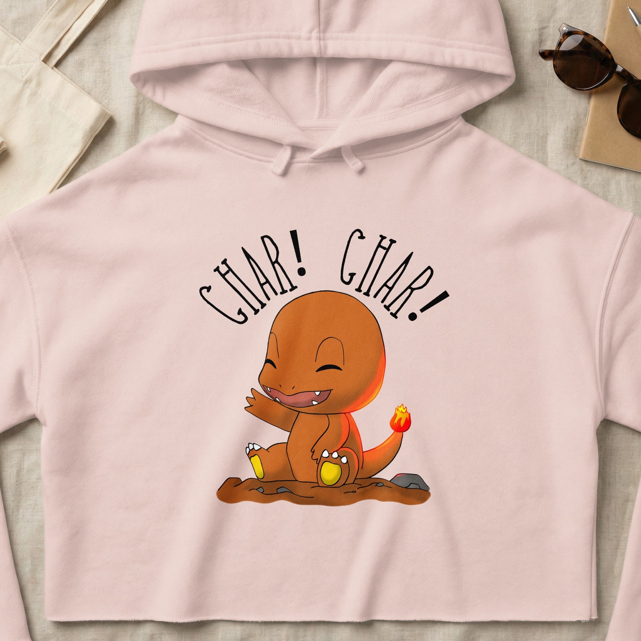 Charmander character with text "CHAR! CHAR!" on a pink hoodie.