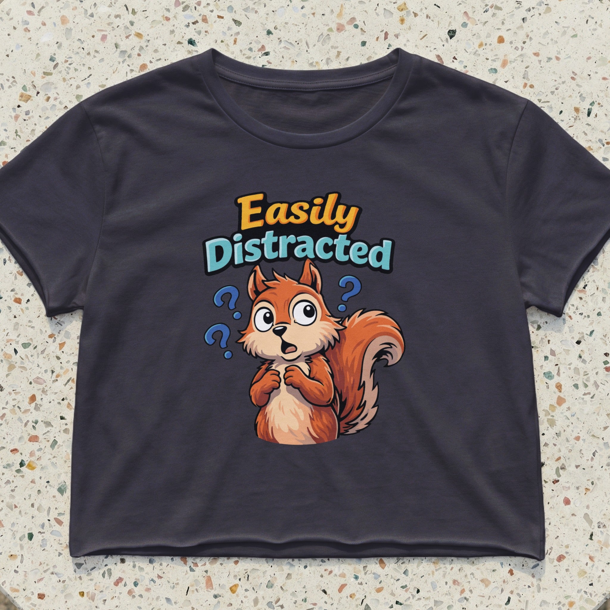 Dark t-shirt with cartoon squirrel and text "Easily Distracted".