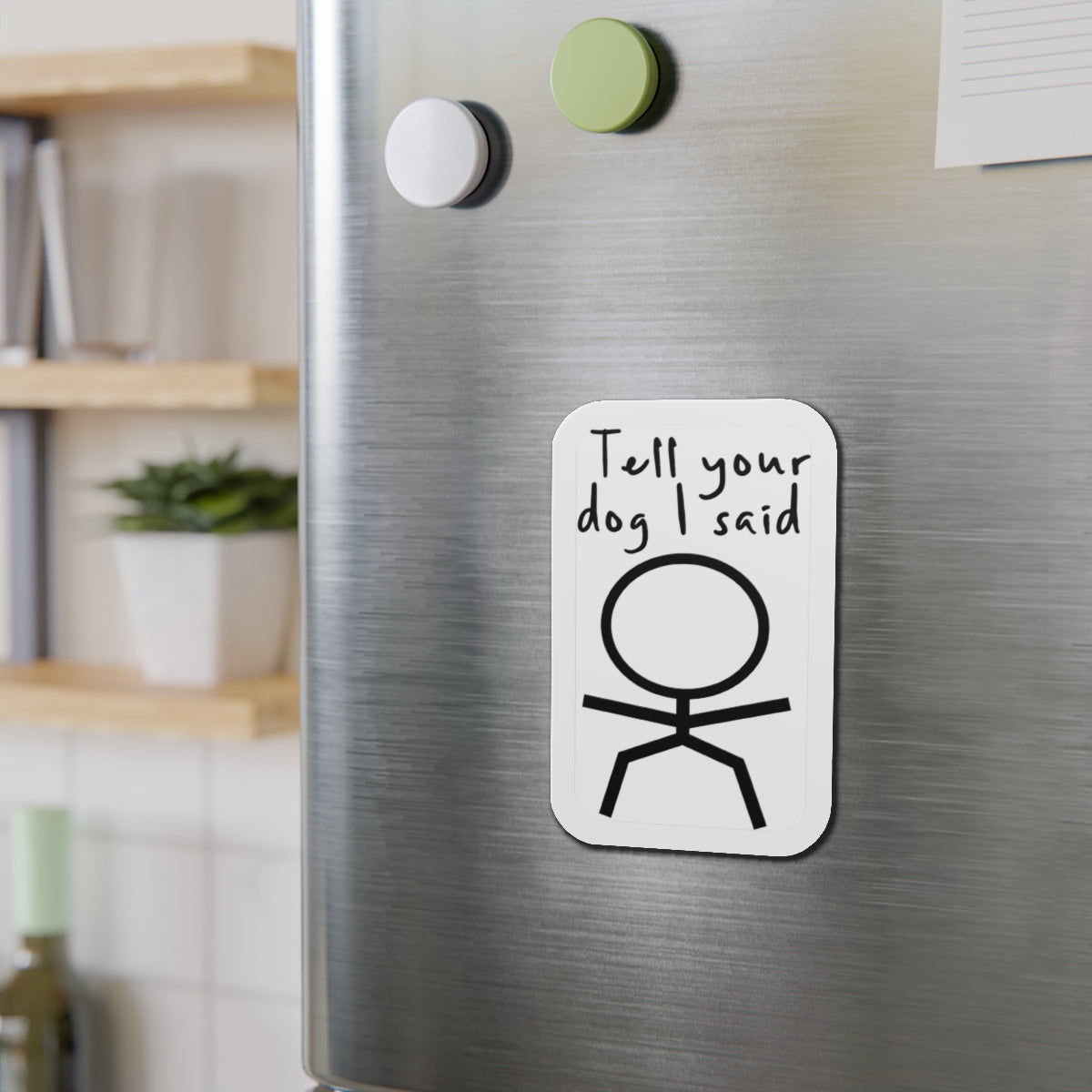 White magnet with stick figure and text "Tell your dog I said".