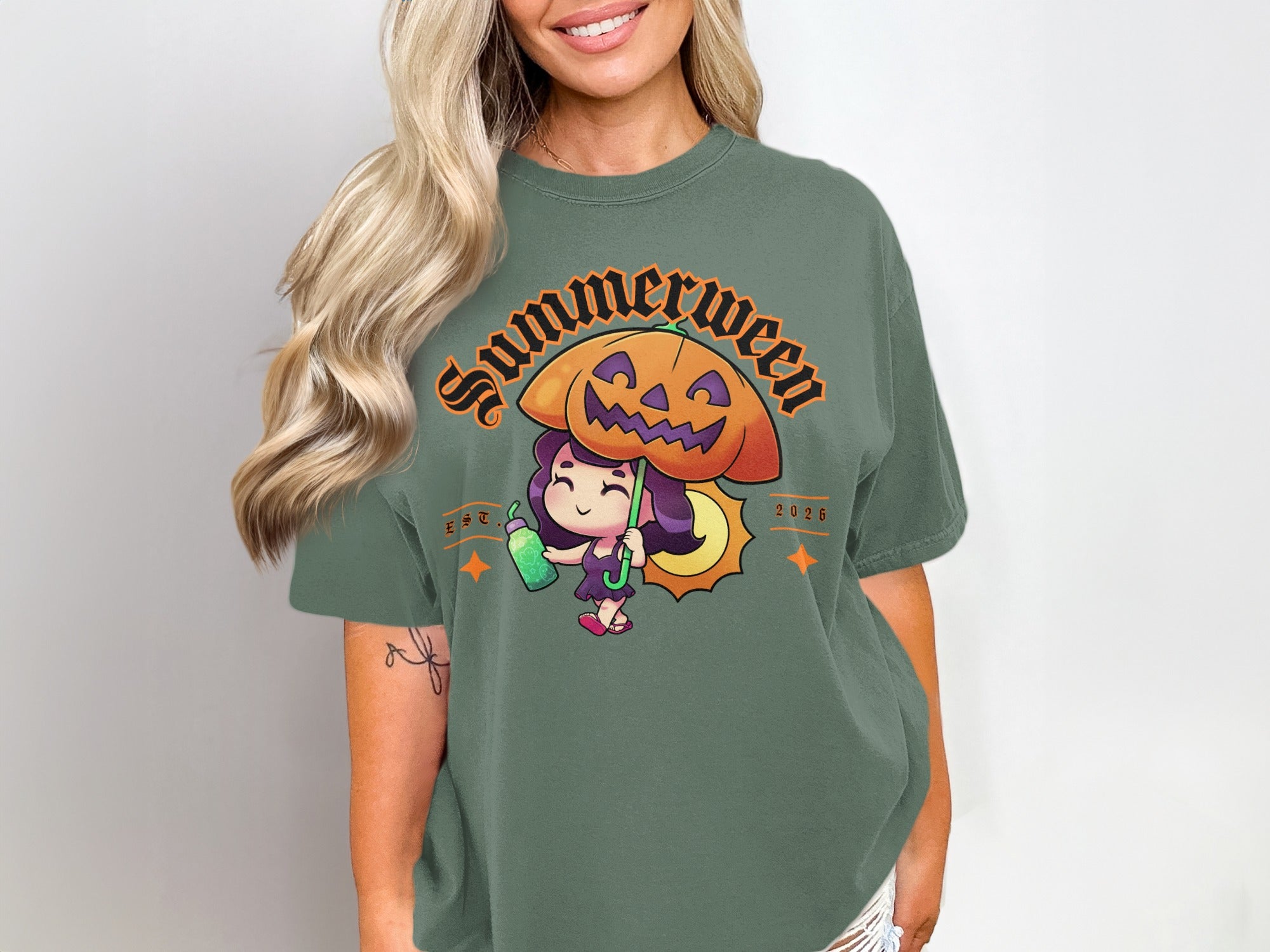Green t-shirt with "Summerween" text, a cartoon girl with a pumpkin umbrella.